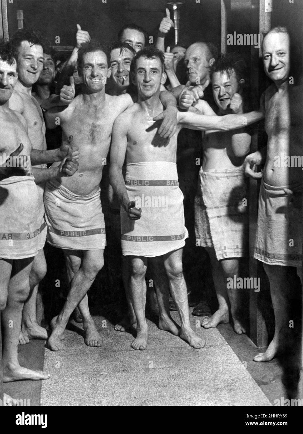 Soldiers from the Royal Pioneer Corps men enjoy a bath after labouring on air raid wreckage October 1940 Stock Photo