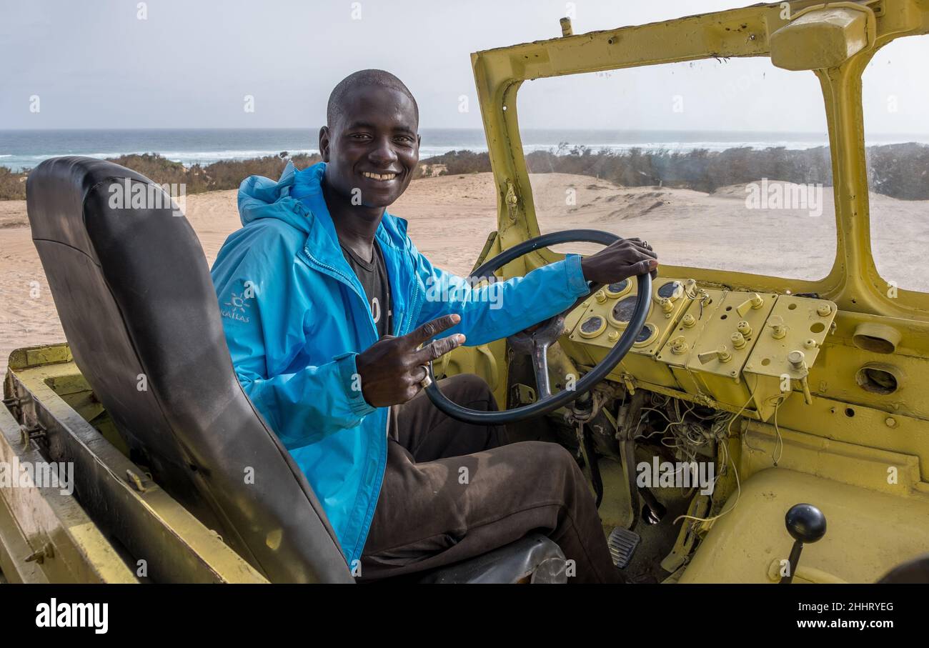 Young driver of an all-terrain truck in the Pink Lake area on the coast of Senegal Stock Photo