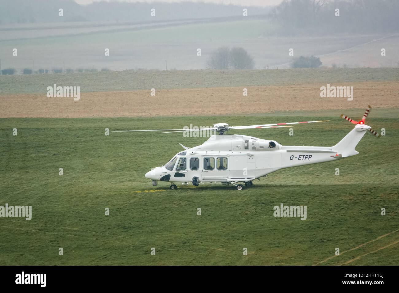 G-ETPP ETPS Agusta AW139 helicopter landing on grass conducting pilot training flight exercise Stock Photo