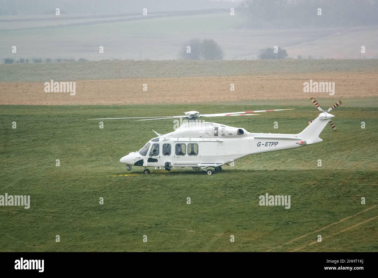 G-ETPP ETPS Agusta AW139 helicopter landing on grass conducting pilot training flight exercise Stock Photo