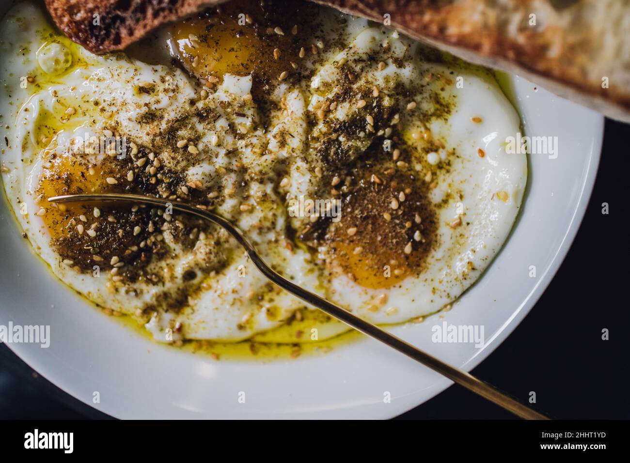 za'atar spiced middle eastern eggs with olive oil and toasted bread