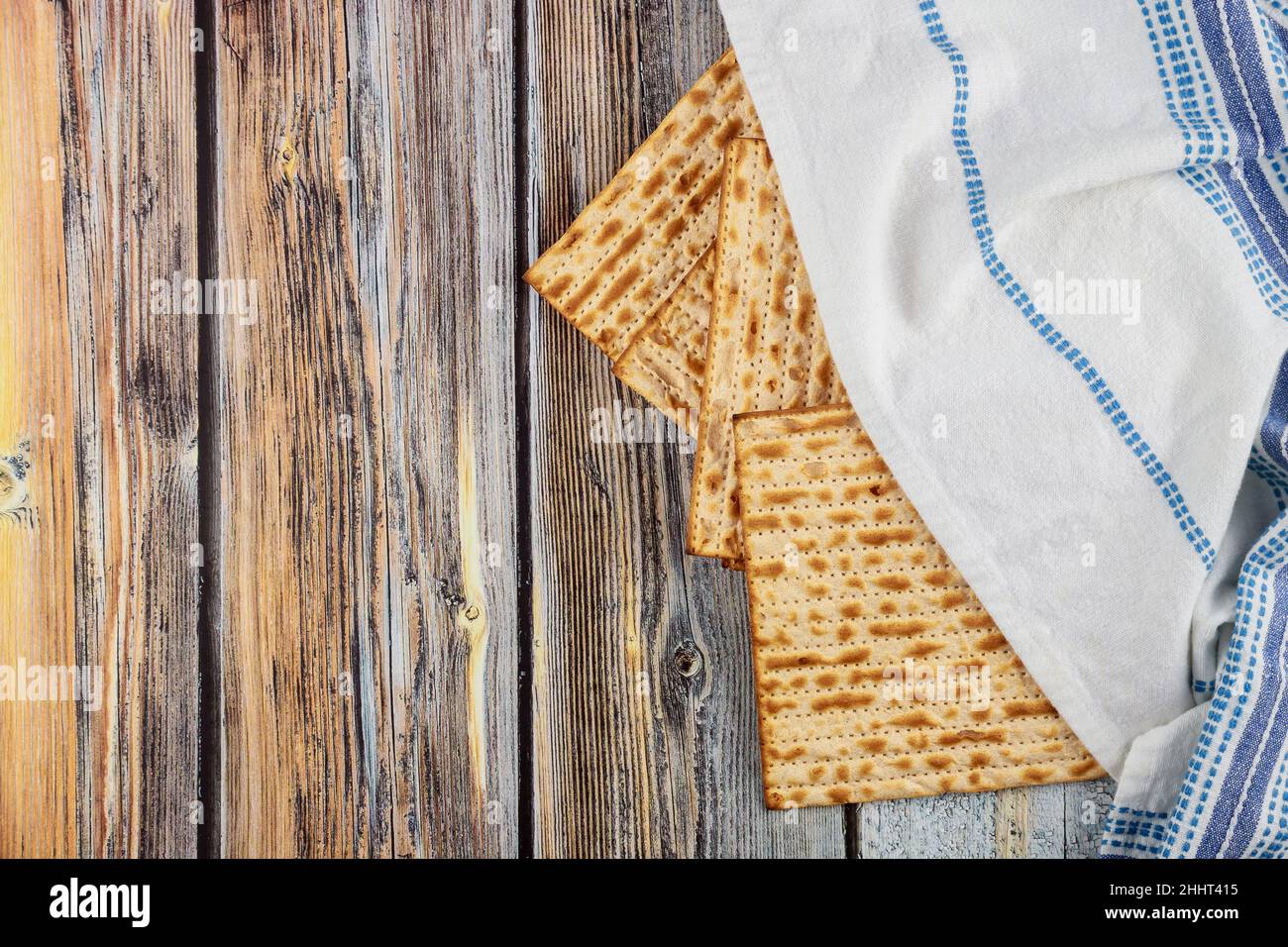 Jewish matzah bread with tallit on wooden rustic background. Passover ...