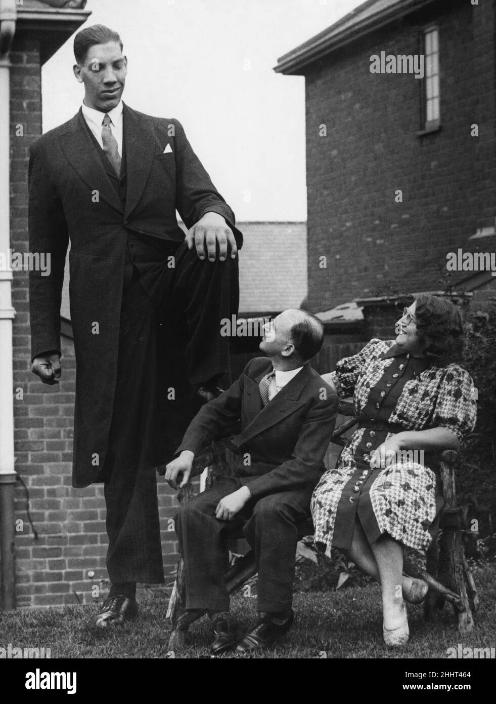 Vaino Myllyrinne the world's tallest man who's height is recorded at 8 feet 3 inches is seen here attending the wedding of Pat Collins in Birmingham . 13th July 1939 Stock Photo