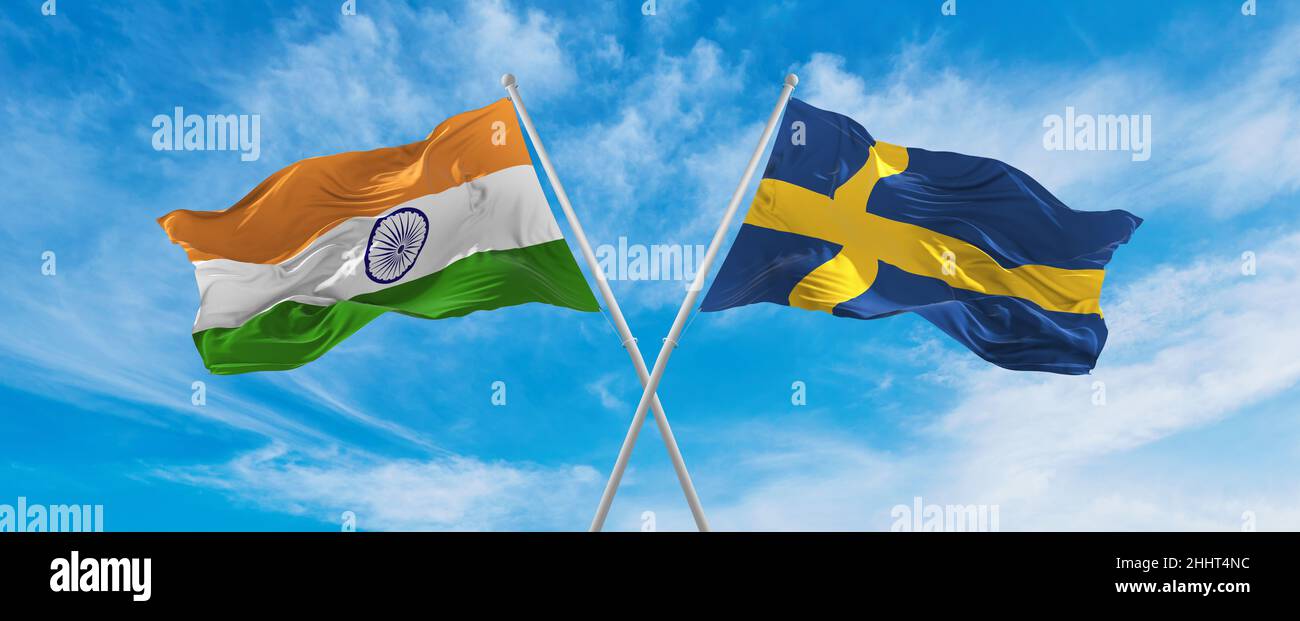 crossed national flags of India and SWEDEN flag waving in the wind at ...