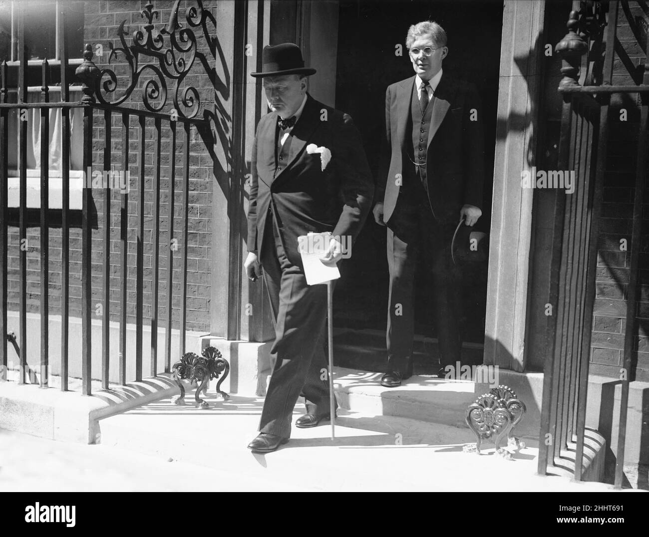 British Prime Minister Winston Churchill leaving Number 10 Downing Street to make a statement in the House of Commons on the capitulation of France during World War Two. His statement went on to be known as the Finest Hour Speech'What General Weygand has called the Battle of France is over. I expect that the Battle of Britain is about to begin. Upon this battle depends the survival of Christian civilisation. Upon it depends our own British life, and the long continuity of our institutions and our Empire. The whole fury and might of the enemy must very soon be turned on us. Hitler knows that he Stock Photo