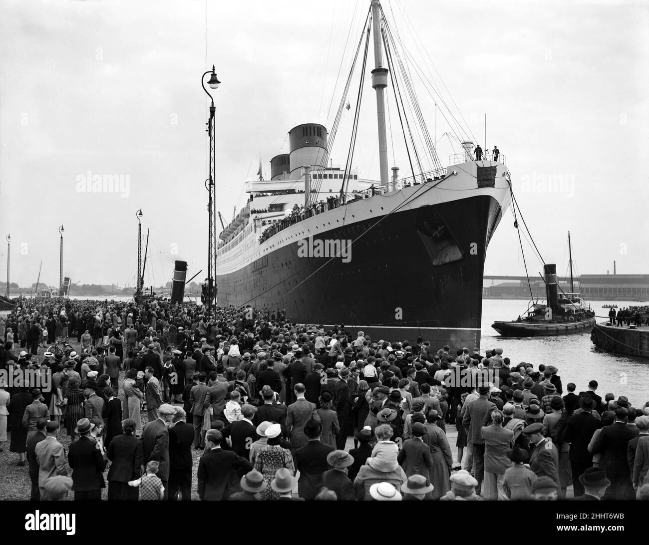 The RMS Mauretania brought up the Thames to King George V Dock at Woolwich.  She is the biggest ship to ever come up the Thames to unload her cargo. 6th August 1939. Stock Photo
