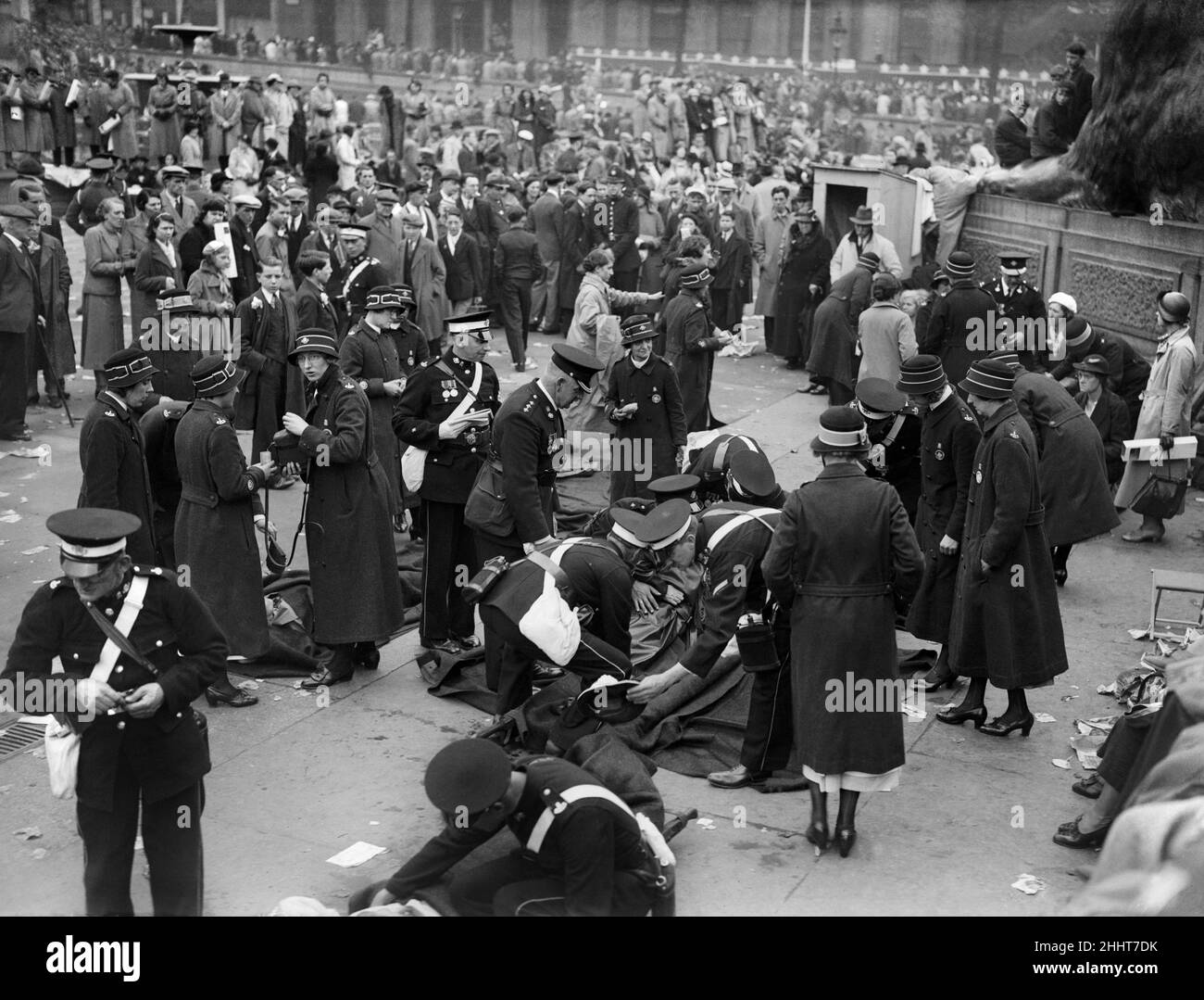 Coronation of King George VI.St Johns Ambulance workers treating injured people in the crowd at Trafalgar Square, awaiting the procession. 12th May 1937. Stock Photo