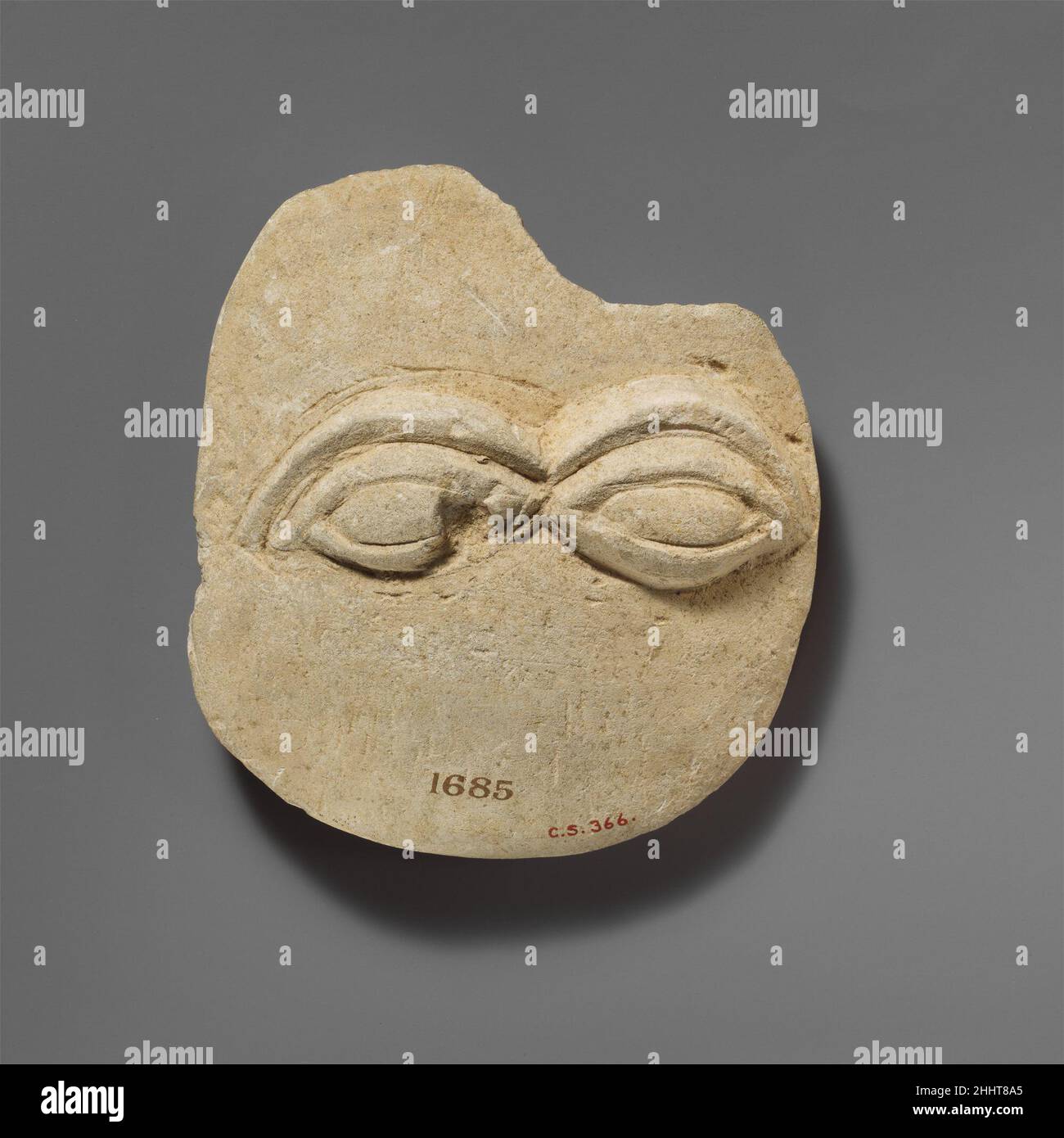 Limestone plaque with two eyes in relief 480–310 B.C. Cypriot The two eyes show very thick eyelids and eyebrows sculpted in relief.. Limestone plaque with two eyes in relief  244048 Stock Photo