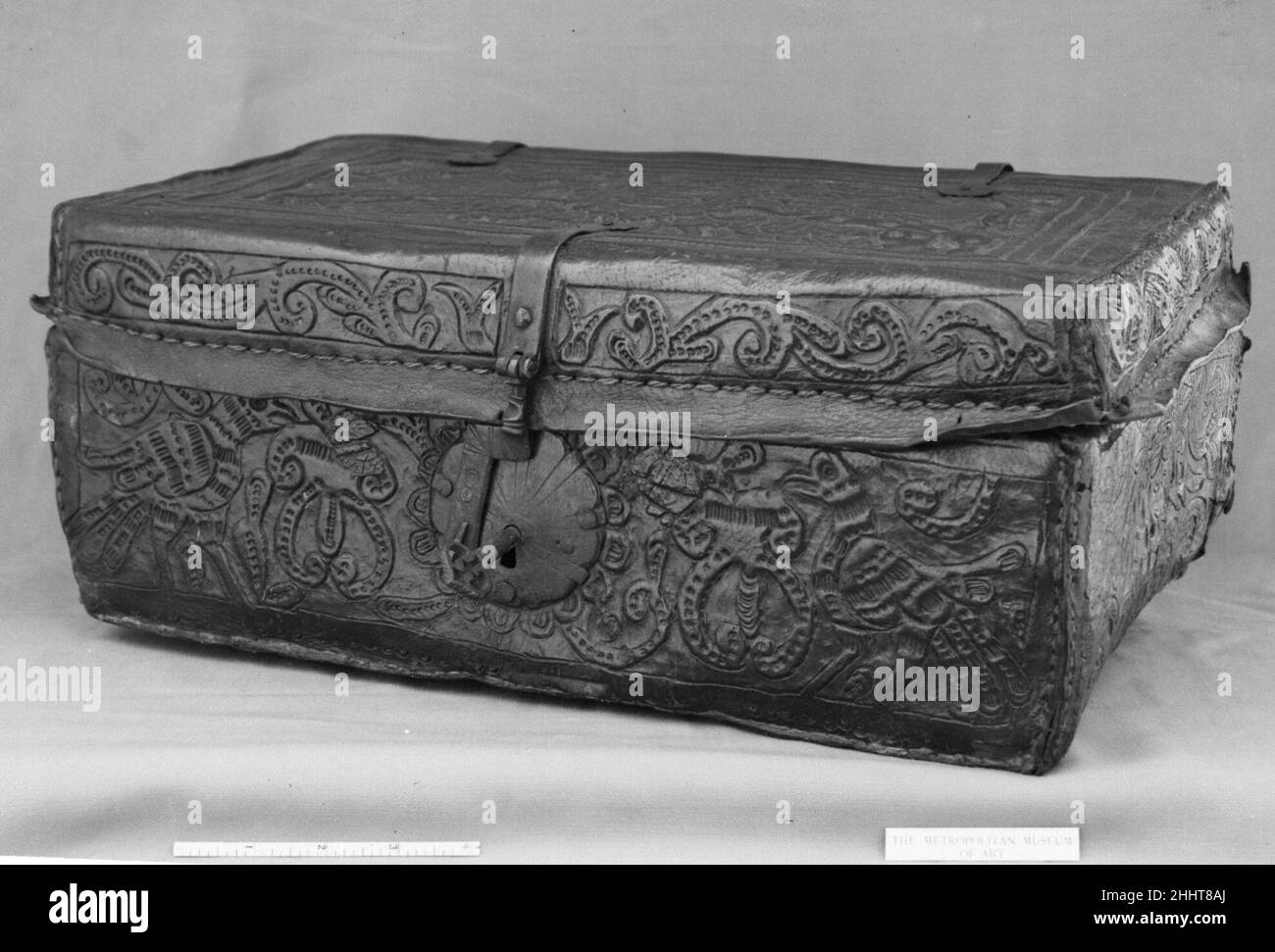 Trunk 17th century Spanish Renowned for their decorative wall hangings, seventeenth-century Spanish leatherworkers also produced utilitarian objects, such as this trunk. The arms, with their winged lion supporters, embossed on the lid are unidentified.. Trunk. Spanish. 17th century. Leather applied to wood, wrought iron. Natural Substances-Leatherwork Stock Photo