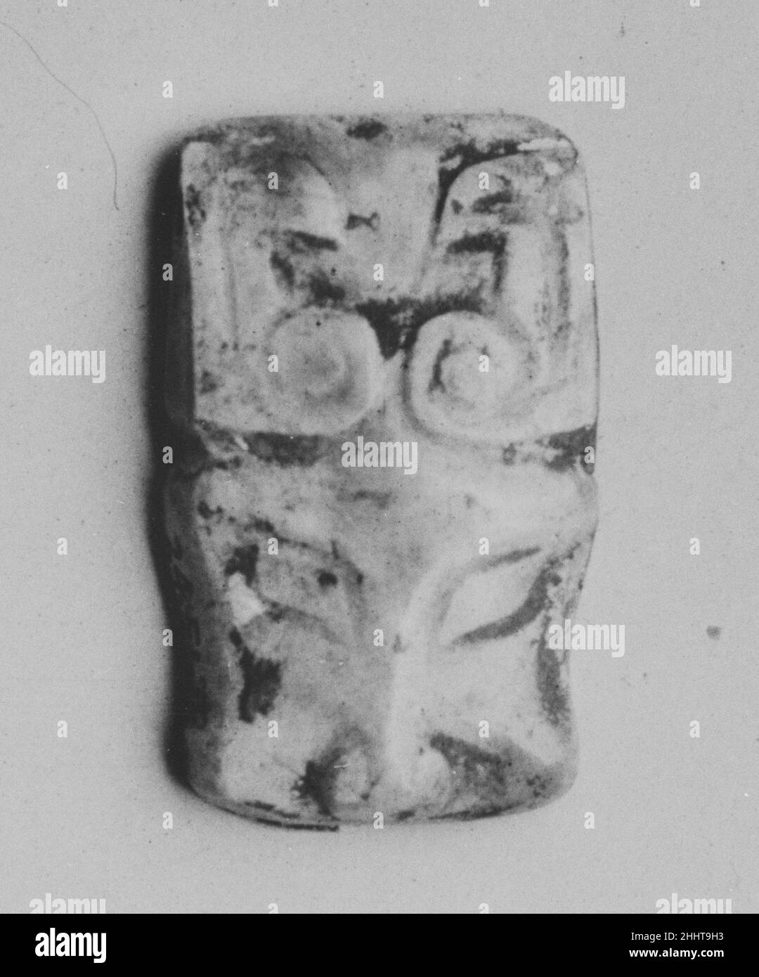 Plaque in the shape of an animal head China. Plaque in the shape of an animal head. China. Jade (nephrite). Western Zhou dynasty (1046–771 B.C.). Jade Stock Photo
