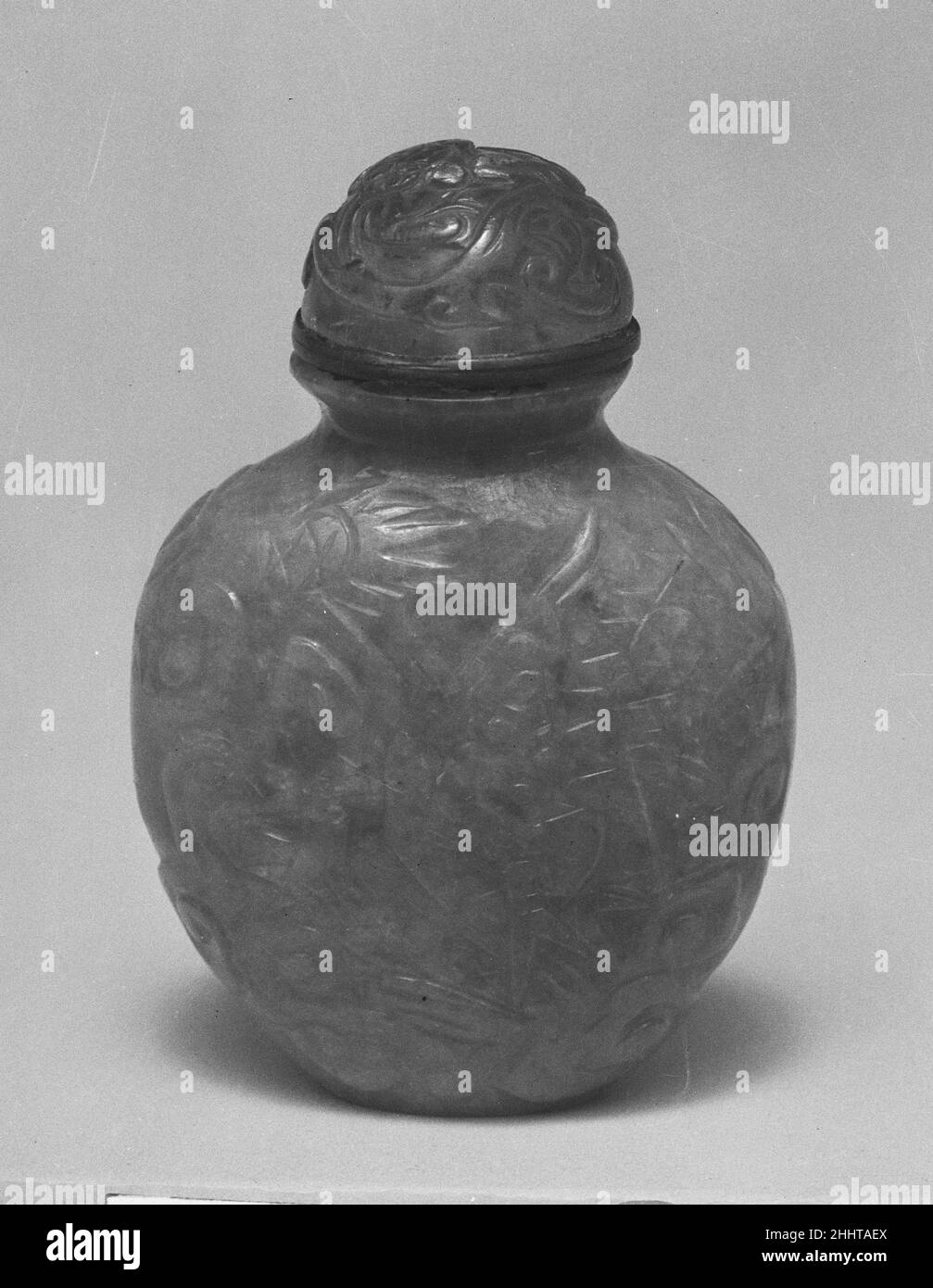 Snuff bottle with stopper China. Snuff bottle with stopper. China. Pale green jadeite, pink glass stopper. Qing dynasty (1644–1911), Kangxi period (1662–1722). Snuff Bottles Stock Photo
