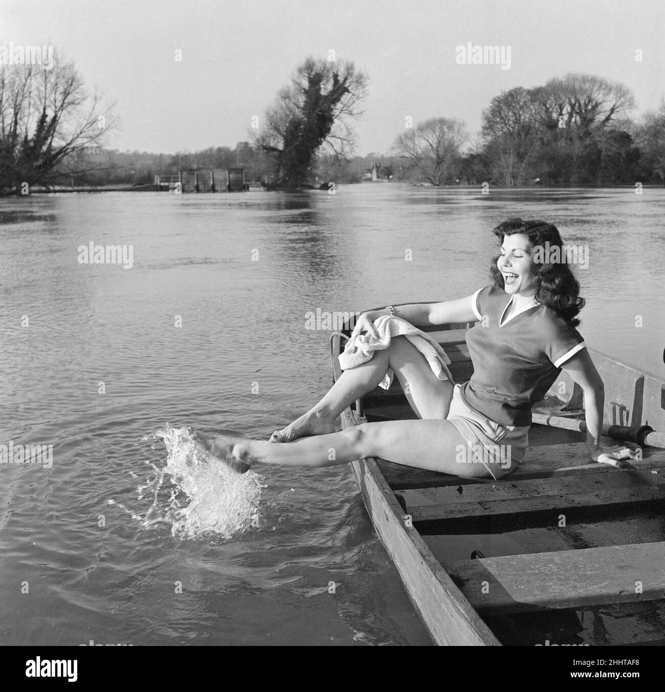 Simone Silva, french actress, making a splash, she plays a beauty queen in a new british film and gets as near to the part as the season will let her, on the flooded Thames, London, 14th April 1951. Stock Photo