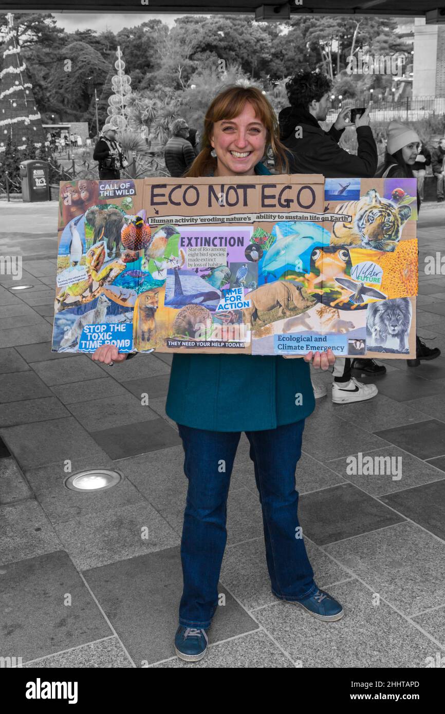 Young Woman Holding Eco Not Ego Placard At Demonstration And March For Global Day Of Action