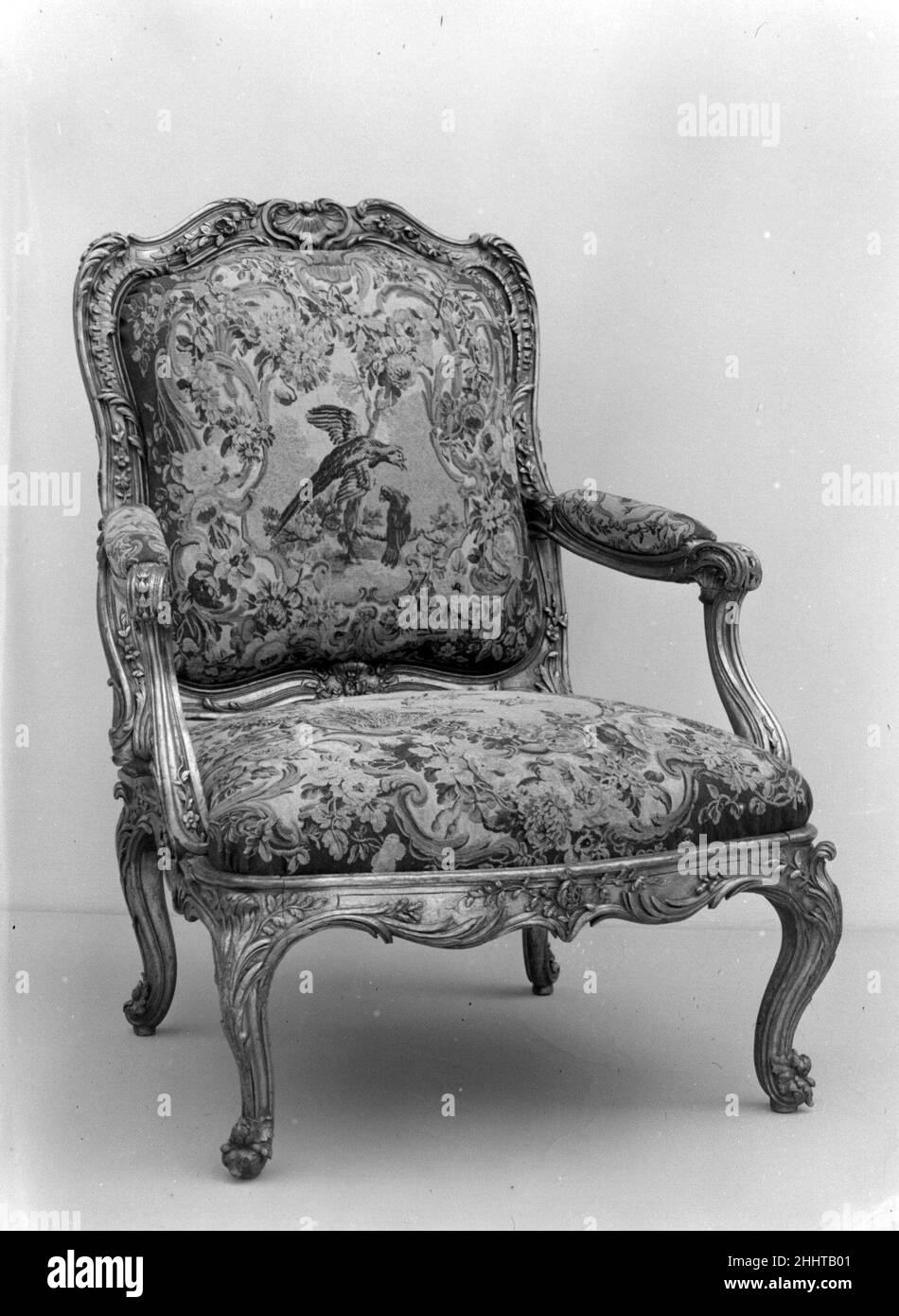 Armchair (part of a set) ca. 1754–56 Frame by Nicolas-Quinibert Foliot This piece is part of a set of twelve armchairs and two settees ordered in Paris in 1753 by Baron Johann Ernst Bernstorff, Danish ambassador to the court of Versailles between 1744 and 1751. After returning to Denmark, Bernstorff commissioned this seat furniture for the tapestry room of his new residence in Copenhagen that was hung with four wall tapestries of the Amours des Dieux series woven at the Beauvais Manufactory. This chair illustrates how French furniture and furnishings were imported all over Europe for the enric Stock Photo