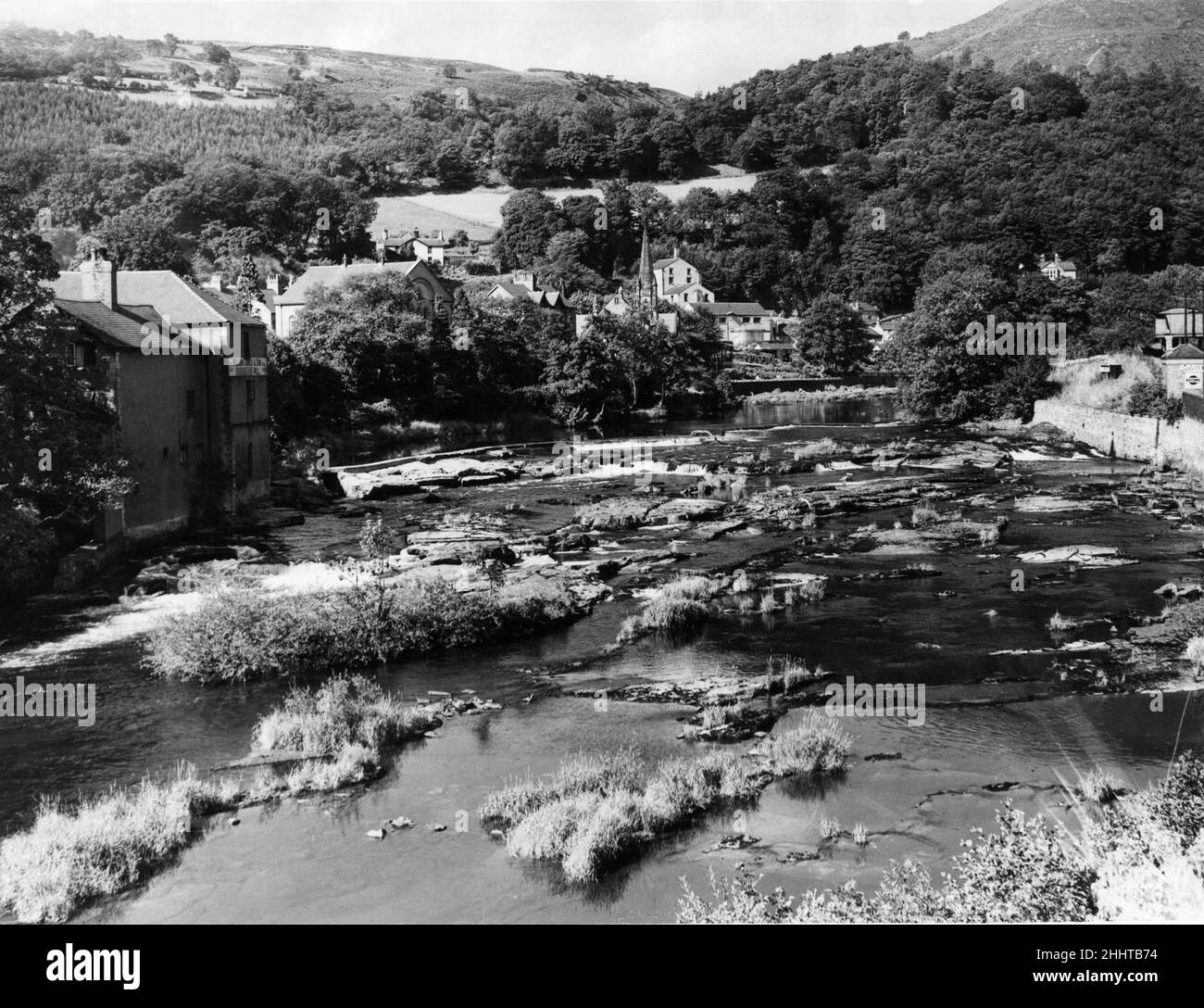 General view showing the River Dee as it meanders through the hill girdled town of Llangollen in Denbighshire, North Wales.October 1943. Stock Photo