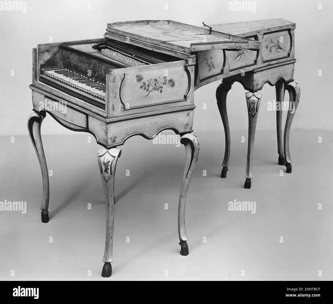 Harpsichord 1773 Giovanni Paolo Leoni Italian Technical description: Inner-outer case construction, interior case and soundboard of cypress, exterior and interior mouldings, bridge, and nut stained black, exterior mouldings include vertical members at every corner to complete a frame around every panel, painted deal exterior case; C/E-c3, 2x8 ', boxwood naturals with boxwood arcades, walnut accidentals with small ivory studs at the rear, three-rail keyframe, keys guided by rear rack; present jacks possibly of fruitwood, with quill springs and plectra, double flag dampers (may not be original); Stock Photo