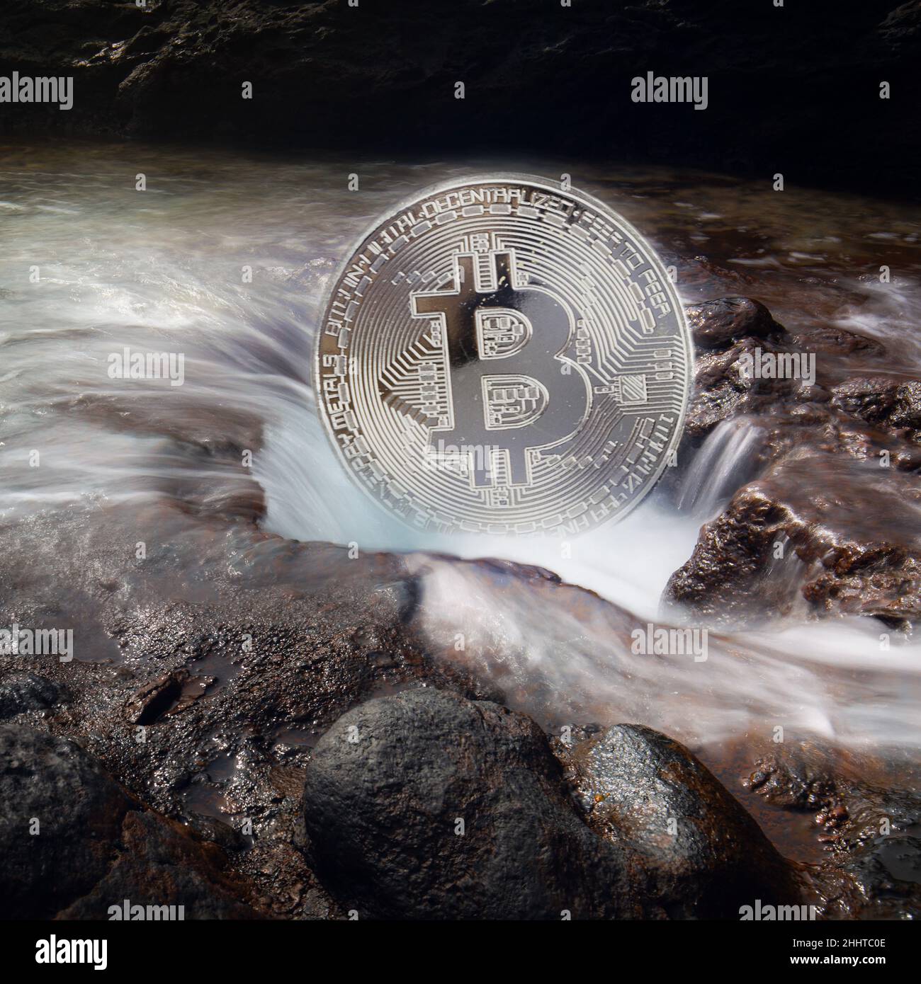 Bitcoin as a symbol of power in connection with our earth Stock Photo
