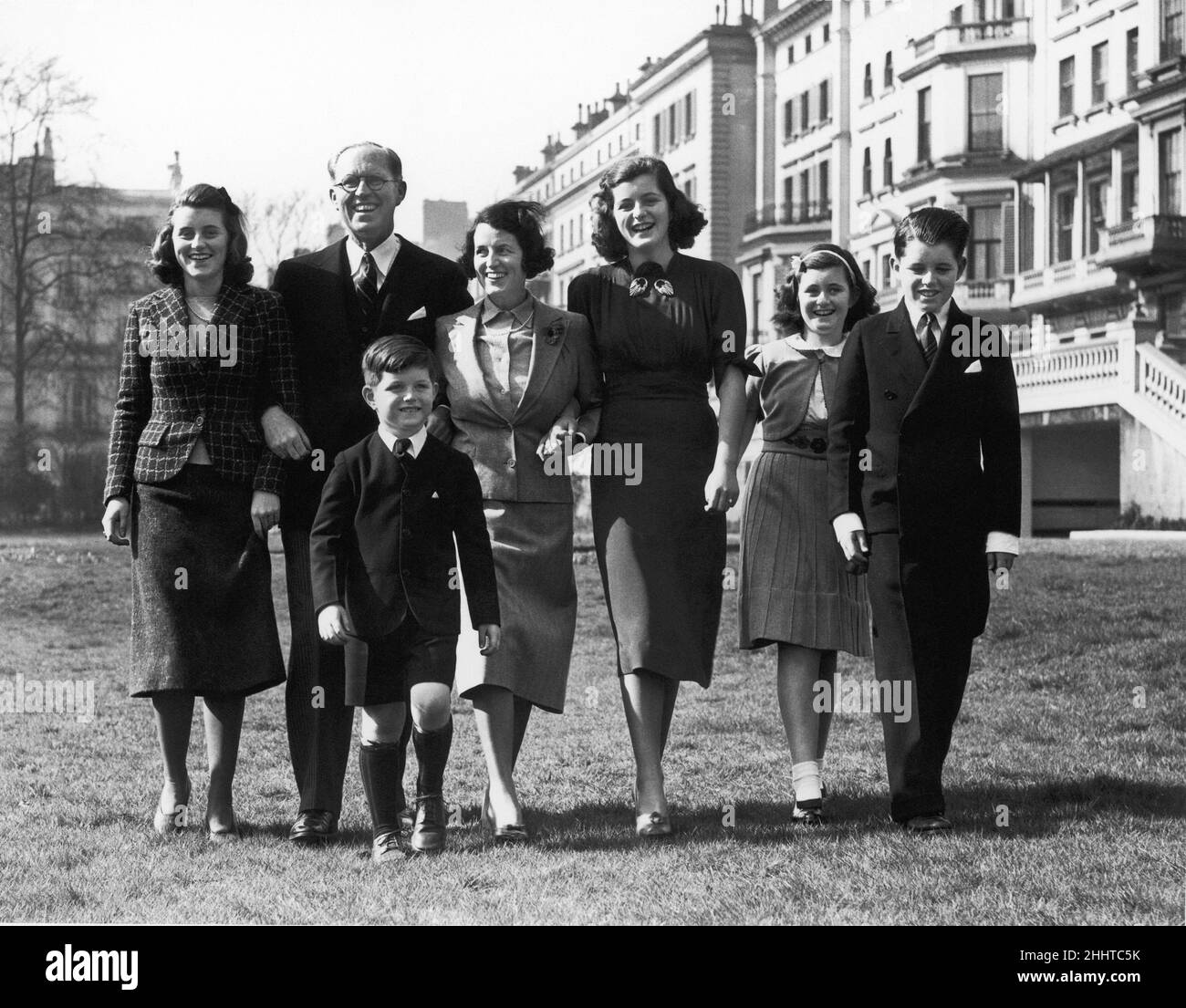 American Ambassador to Britain Joe Kennedy walking in London with his family. Left to right are: Kathleen Kennedy, Joseph Kennedy, Rose Kennedy, Patricia Kennedy, Jean Kennedy, Bobby Kennedy and young Edward Kennedy. 1st March 1938. Stock Photo