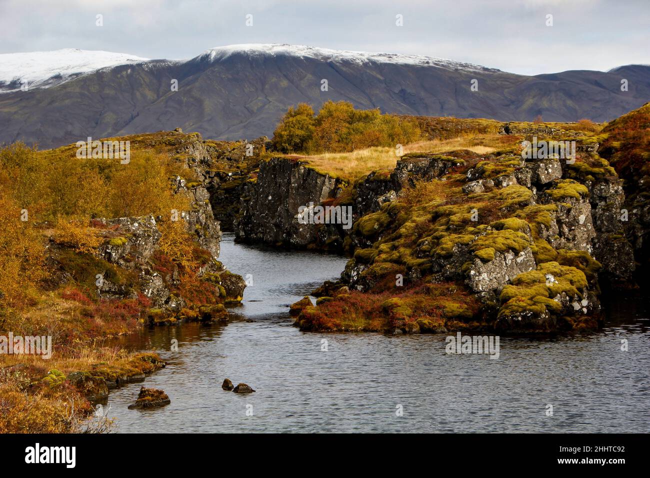 Water filled rift/canyon at Thingvellir National Park during autumn ...