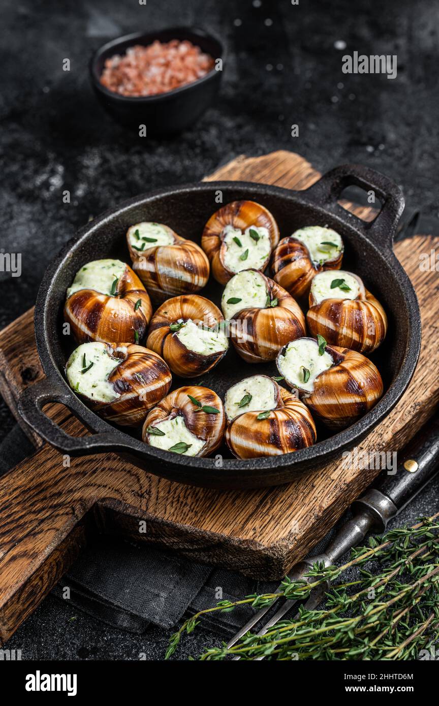 Delicatessen food Bourgogne Escargot Snails with garlic butter in a