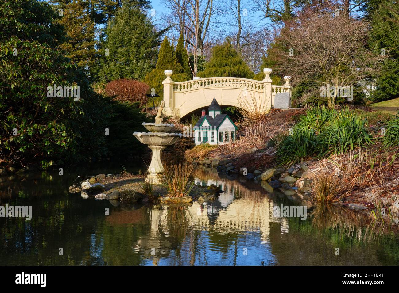 Inside Halifax Public Gardens, victorian footbridge over pond with