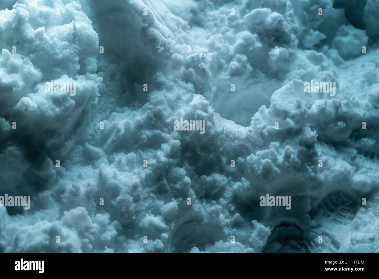 Snow surface. Fresh fluffy snow texture. Blue light luminance Stock Photo