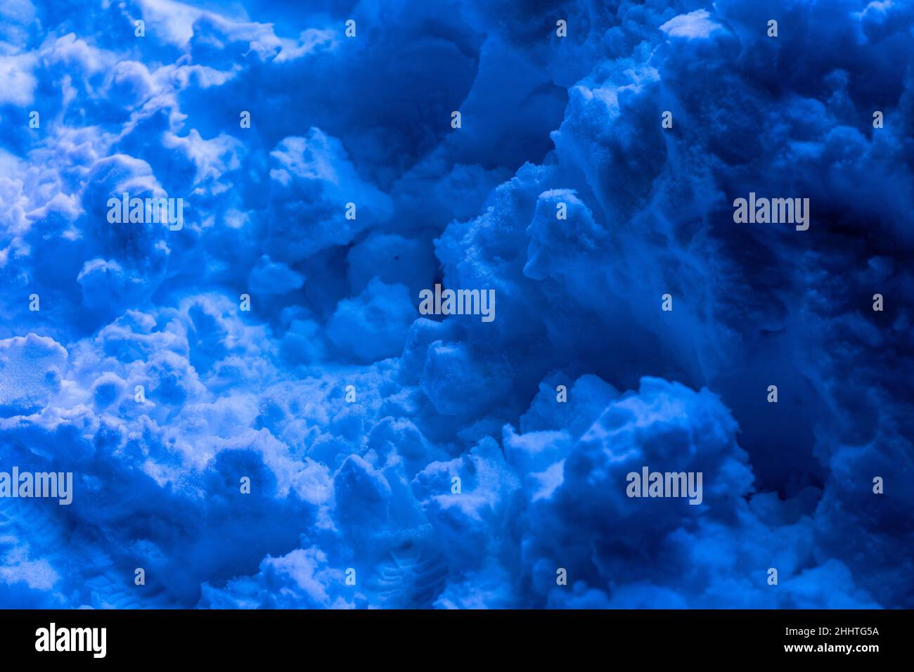 Snow surface. Fresh fluffy snow texture. Blue light luminance Stock Photo