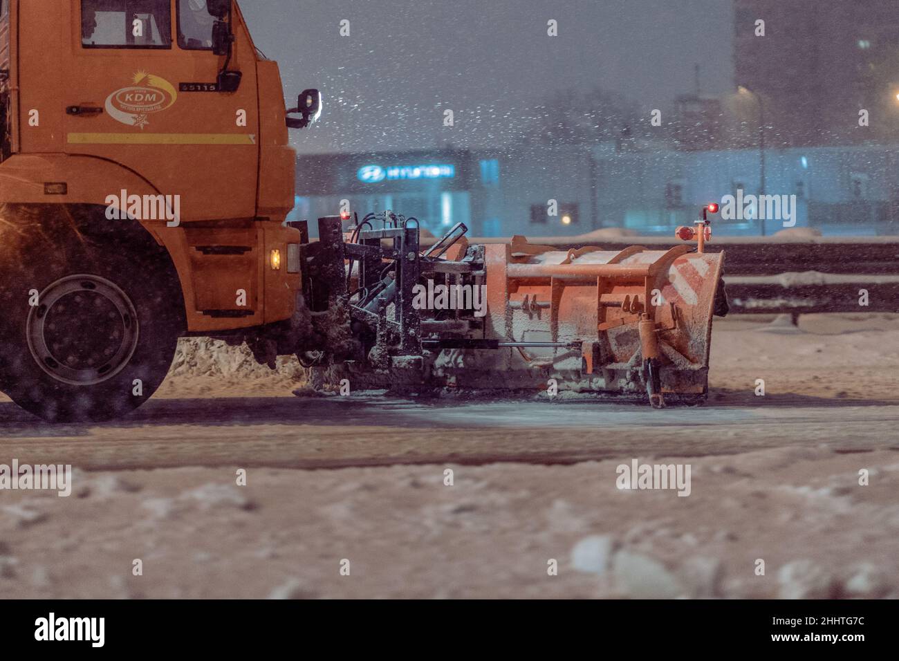 Krasnodar, Russia - January 23 2022: Snow removing machine cleans the street from the snow in the city Stock Photo