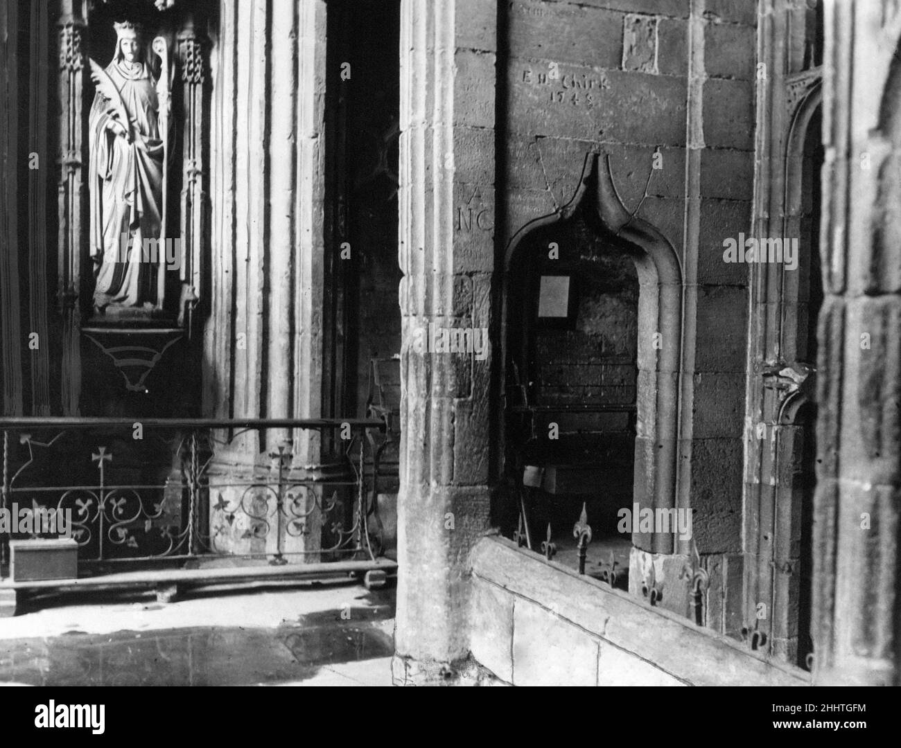 St Winefride's Well Shrine in Holywell, Flintshire, Wales, 28th December 1948. Our Picture Shows ... interior view of shrine, showing the statue of St Winefride and the entrance to the ladies bath.  Also know as Winifred's Well, it claims to be the oldest continually visited pilgrimage site in Great Britain (over 1300 years) and is a grade I listed building.   Pilgrims have visited St Winefride's Well throughout its history, to seek healing. Stock Photo
