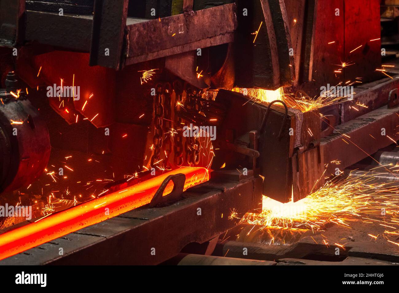The process of cutting hot rolled steel into lengths Stock Photo