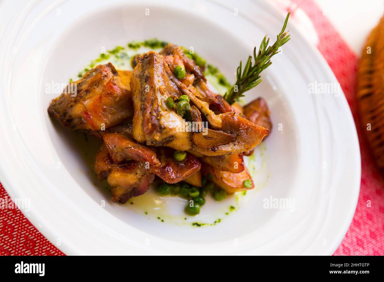 Baked rabbit meat with garlic Stock Photo - Alamy
