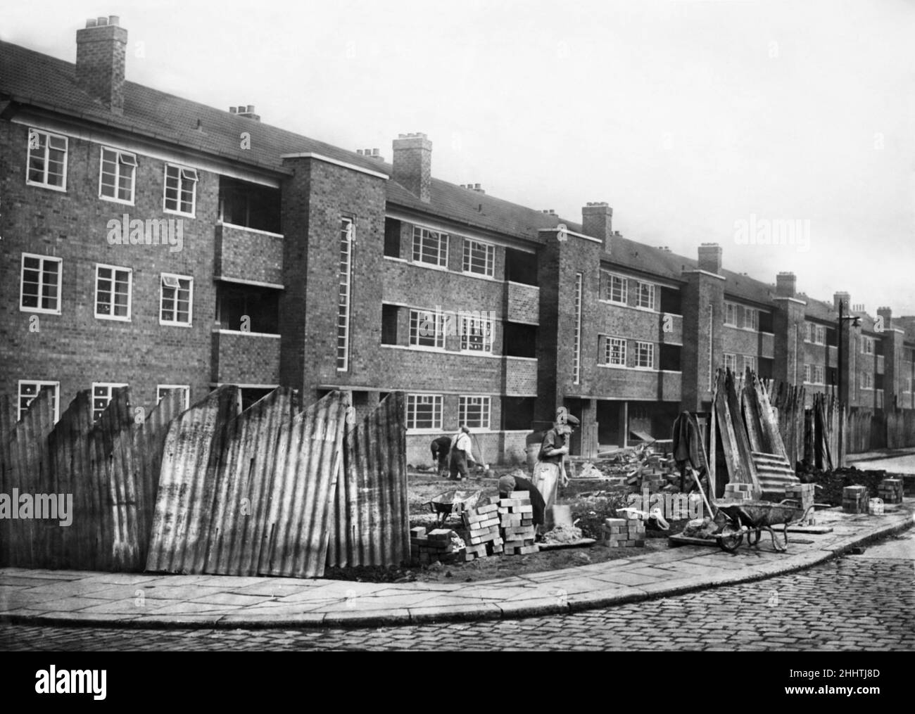 Putting the finishing touches to the new block of flats near Willert Street Police Station on Rochdale Road, Manchester  11th September 1948 Stock Photo