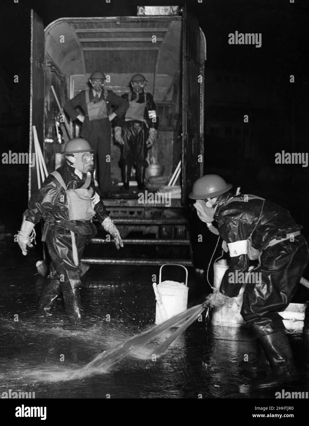 Merseyside ARP team seen here wearing their gas suits and masks during a gas decontamination exercise, 14th July 1939 Stock Photo