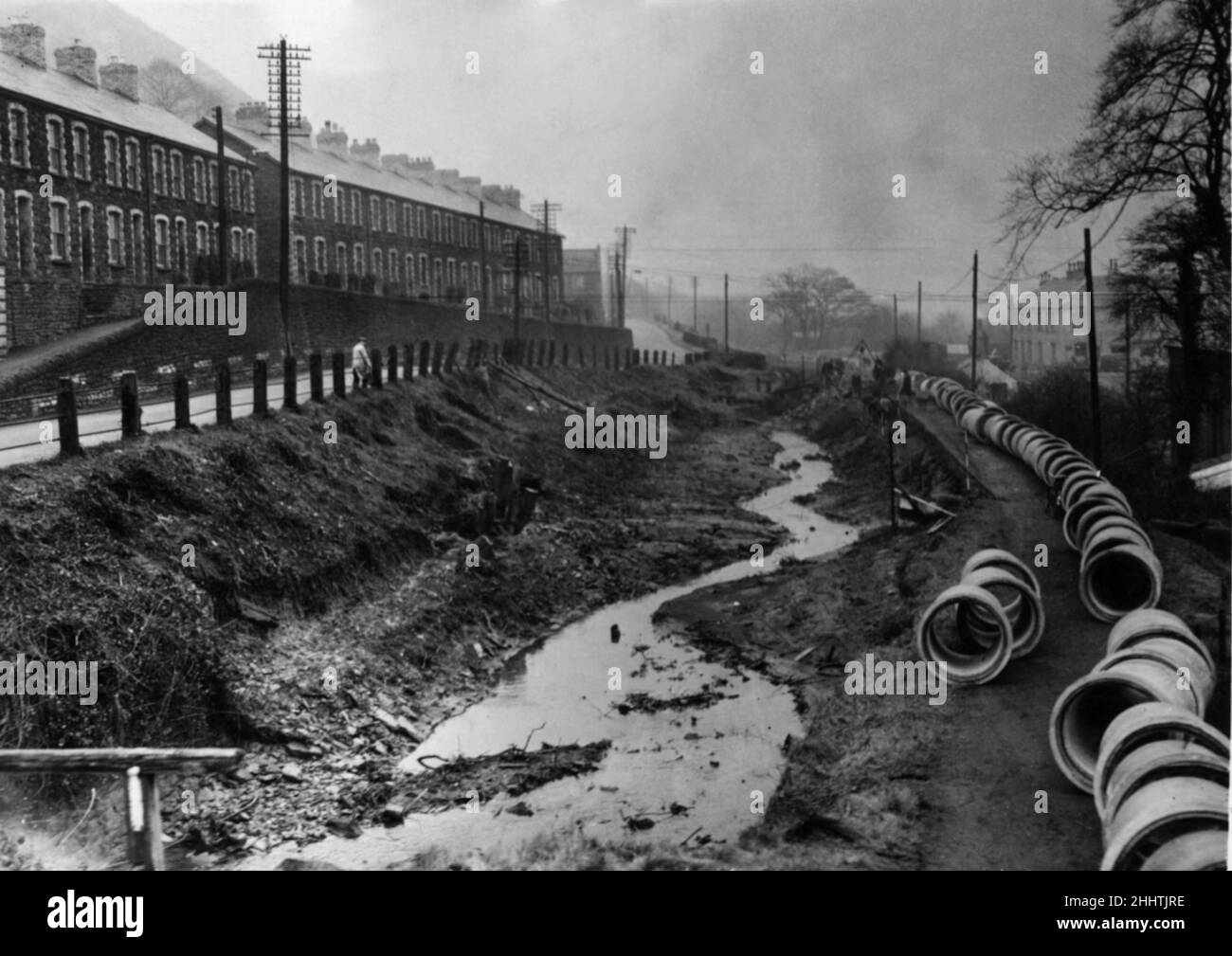 Road improvement Cwmcarn and Abercarn will mean enclosing the canal between the two community's and covering over the pipe works with earth and cement to form the foundations for a wider road. 18th January 1951 Stock Photo