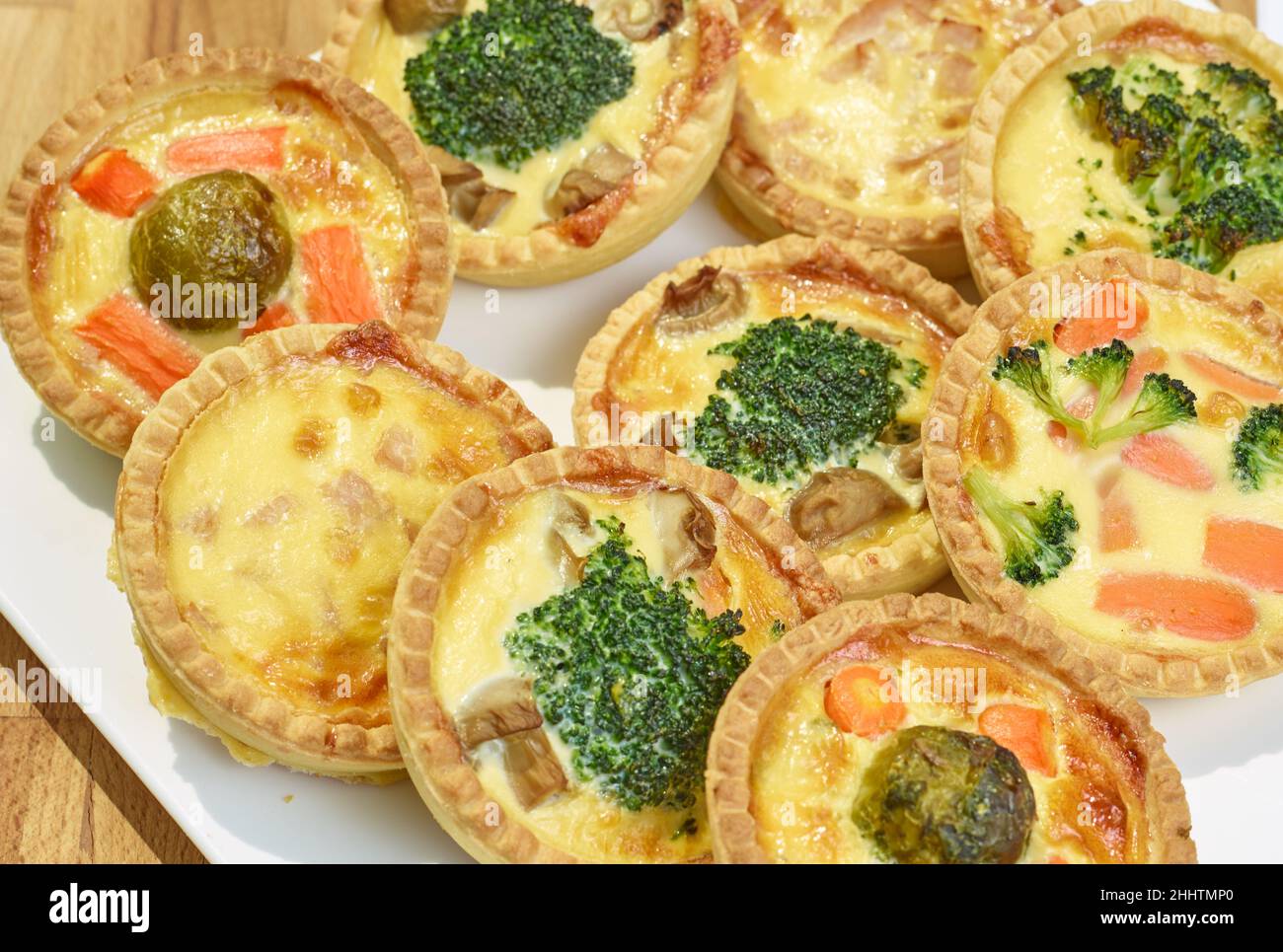 Baked homemade quiche pie served with fresh greens Stock Photo Alamy