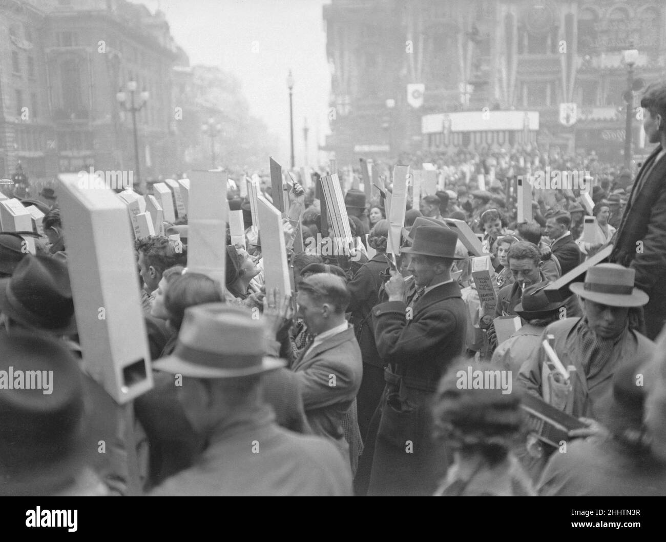 Coronation of King George VI.Huge crowds of people with their periscopes to get a better view of the event as they await the arrival of the procession. 12th May 1937. Stock Photo