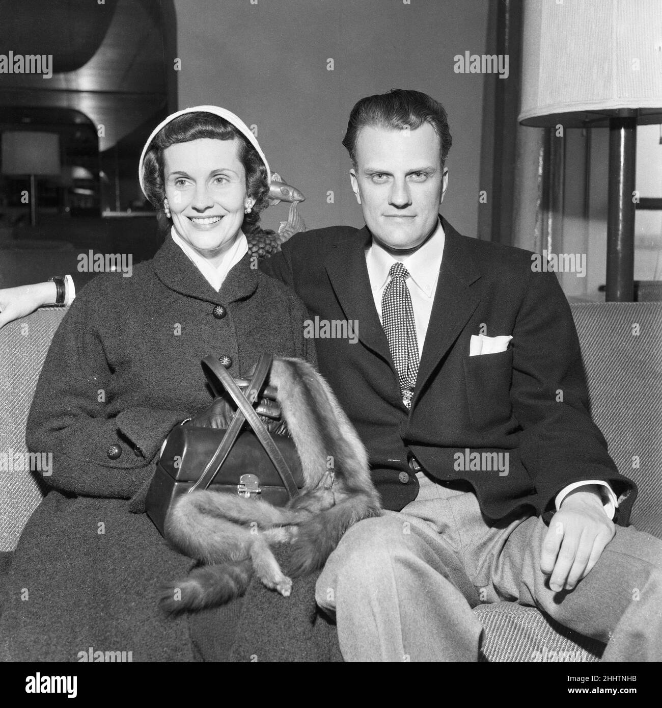 American evangelist Billy Graham pictured with his wife Ruth upon arrival at Southampton to begin his three month London Crusade. 23rd February 1954. Stock Photo