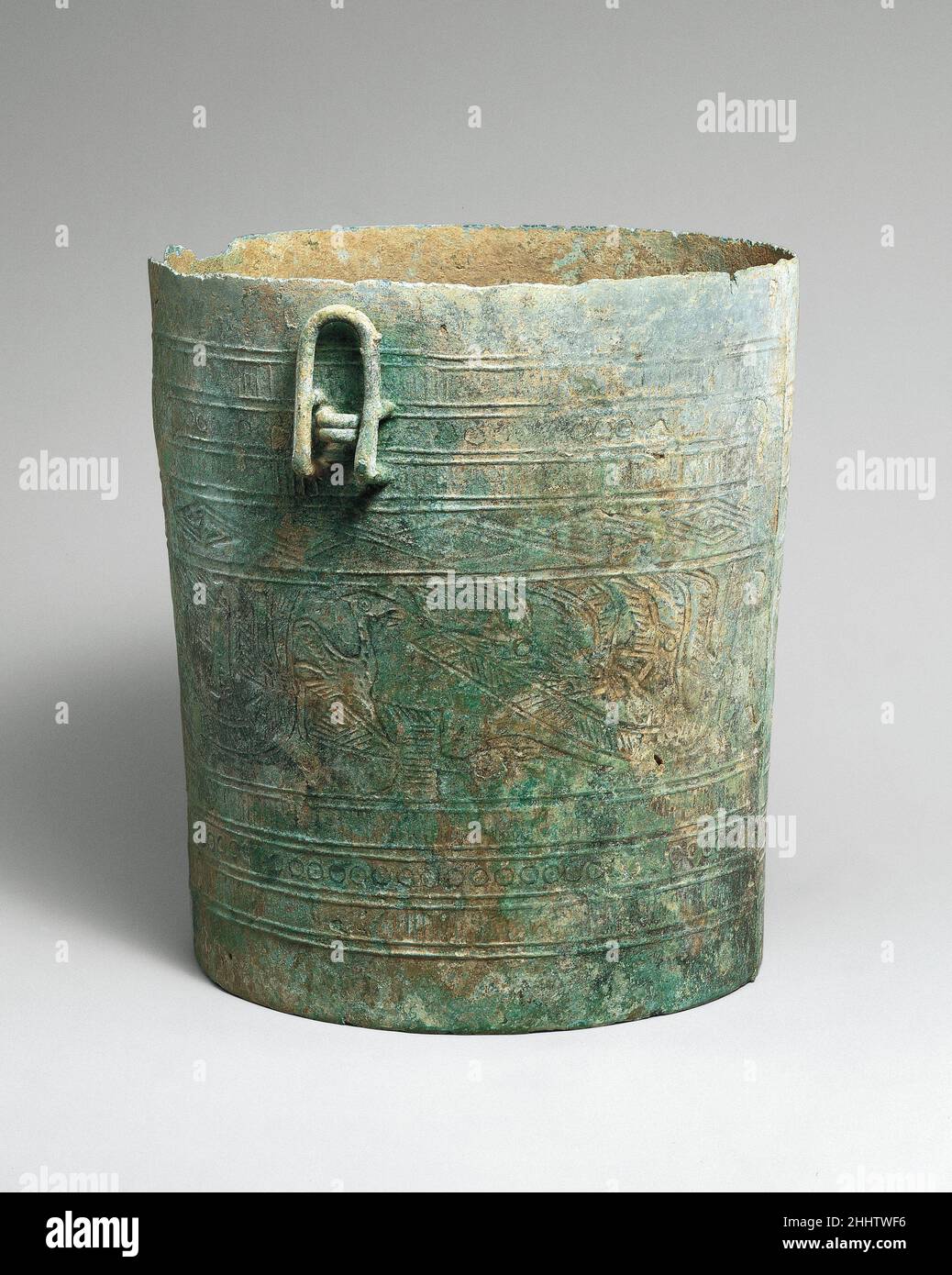 Situla with Design of Boats ca. 500 B.C.–A.D. 300 Vietnam Axes, situlae, and drums play an important role in Vietnam's Dongson culture named after a site located on the coastline to the south of present-day Hanoi that was first excavated in 1924. The four long boats with seated warriors in the central horizontal band of this bucket shaped vessel, common images in the art of the Dongson culture, are also depicted, albeit more summarily, on the sides on the bronze model of a drum in this case. There had been much speculation regarding the meaning of this theme, which is interpreted as representa Stock Photo