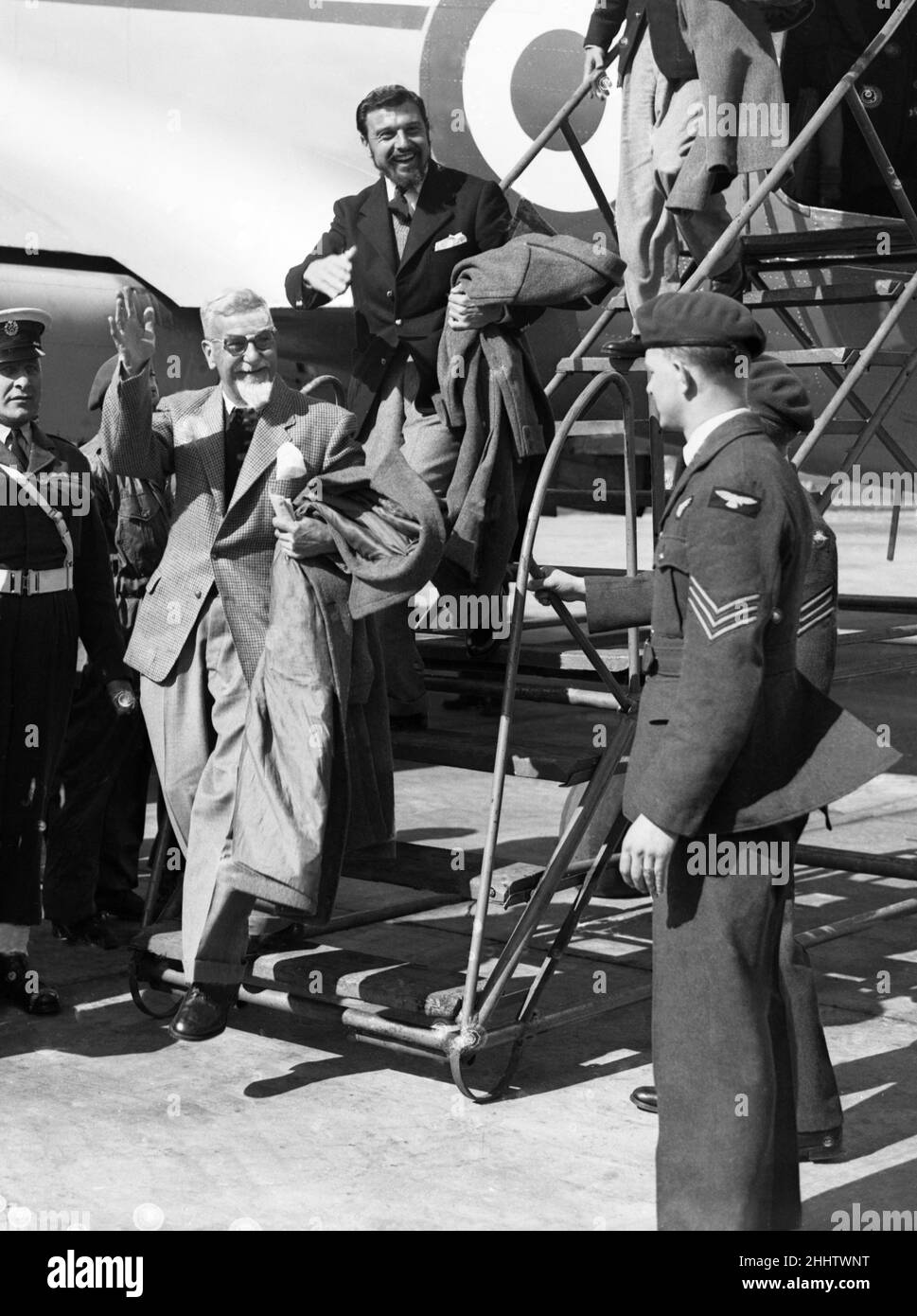 George Blake seen here at the top of the stairs disembarking  from an RAF transport plane in Abingdon, Oxfordshire, England following three years of internment in North Korea. Blake had been sent to South Korea as a dipolmat but within months of his arrival in Seoul, the city was captured by the advancing North Korean Army and Blake was taken prisoner. After capture by the North Koreans, and after reading the works of Karl Marx during his three-year detention, he converted to Marxism. Following his release he was sent by MI6 to work in Berlin, where he made contact with the KGB and betrayed th Stock Photo