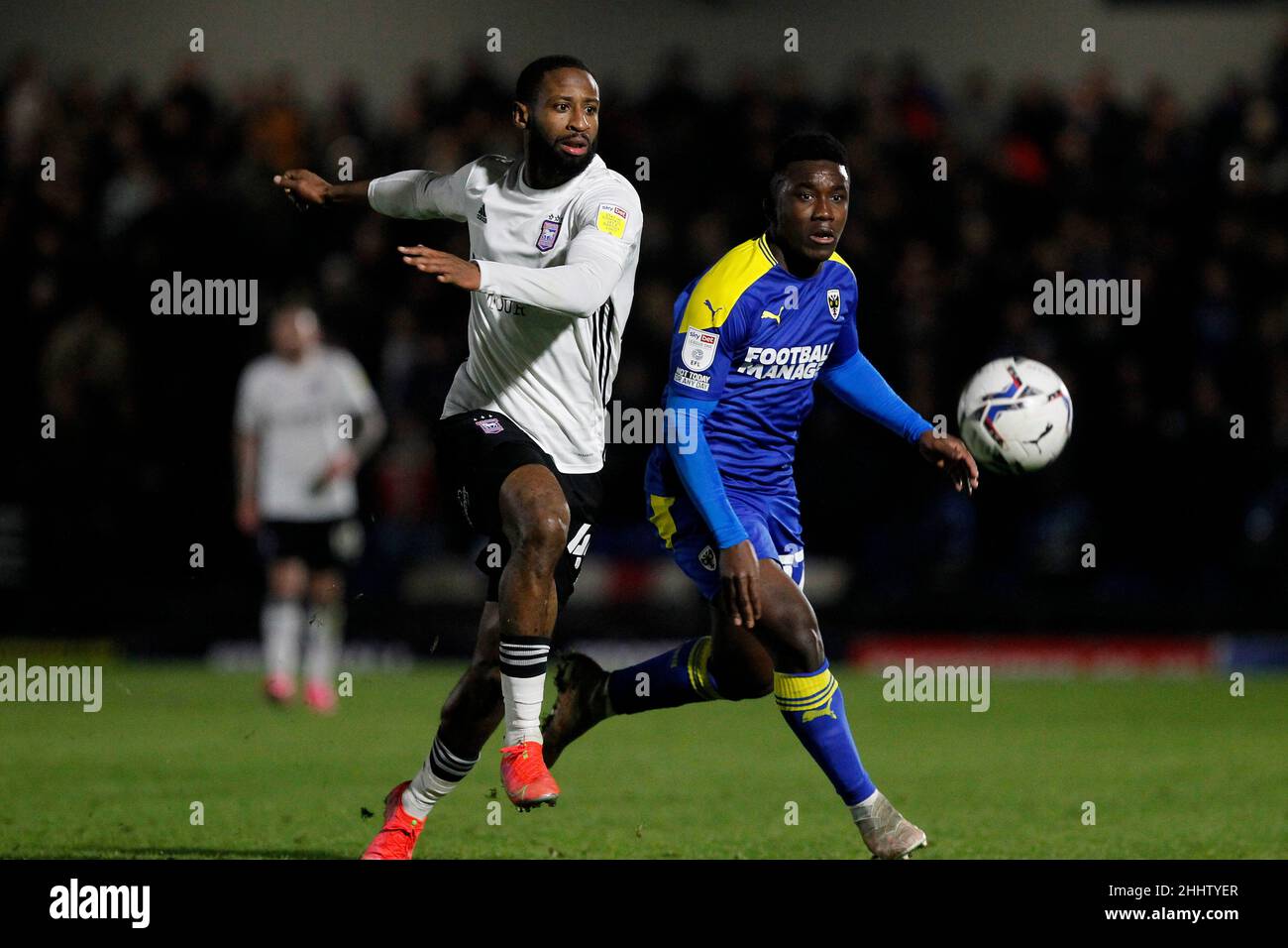 London, UK. 25th Jan, 2022. Terry Ablade of AFC Wimbledon and Rekeem Harper of Ipswich Town during the EFL Sky Bet League 1 match between AFC Wimbledon and Ipswich Town at Plough Lane, London, England on 25 January 2022. Photo by Carlton Myrie. Editorial use only, license required for commercial use. No use in betting, games or a single club/league/player publications. Credit: UK Sports Pics Ltd/Alamy Live News Stock Photo