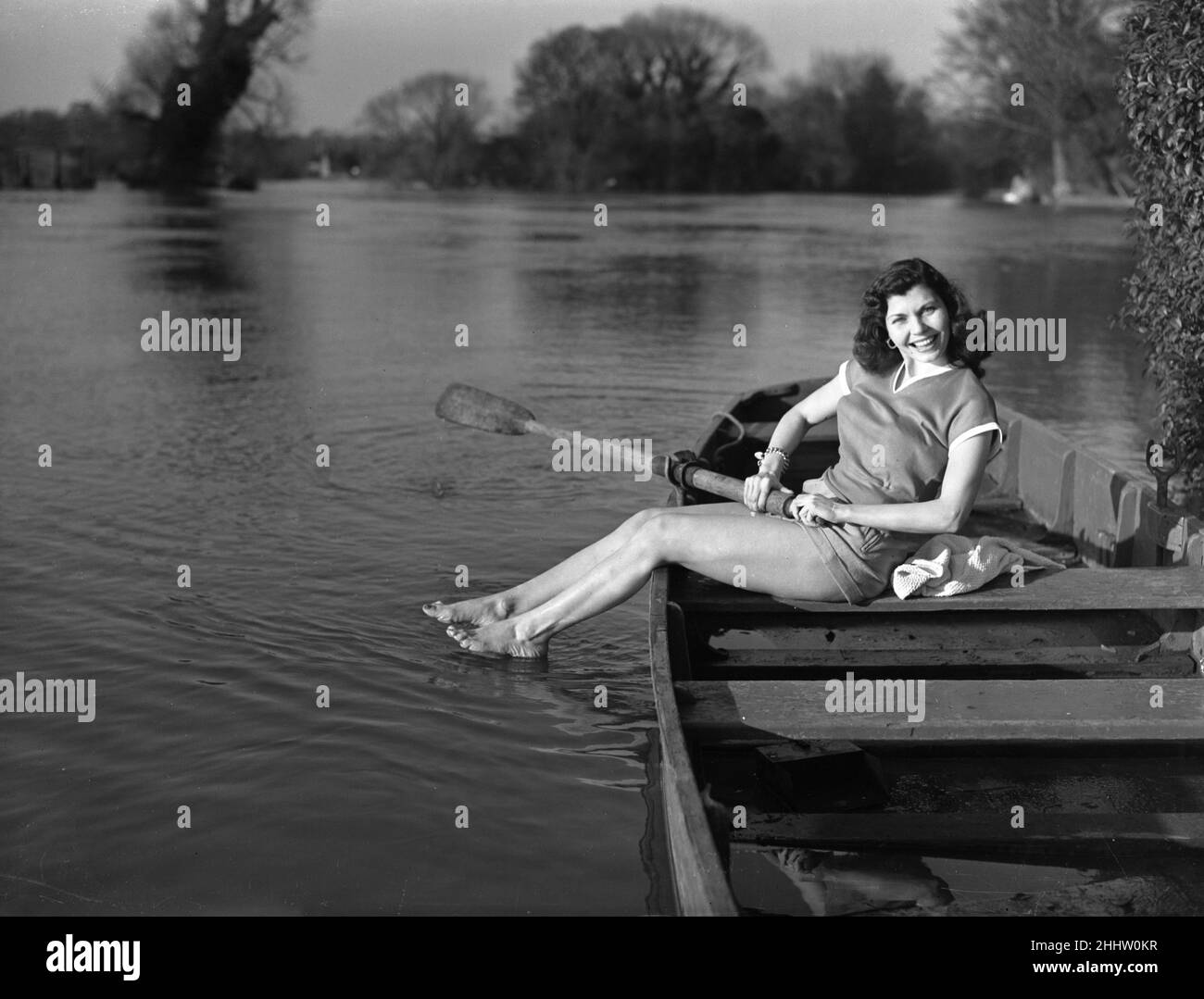 Simone Silva, french actress, making a splash, she plays a beauty queen in a new british film and gets as near to the part as the season will let her, on the flooded Thames, London, 14th April 1951. Stock Photo