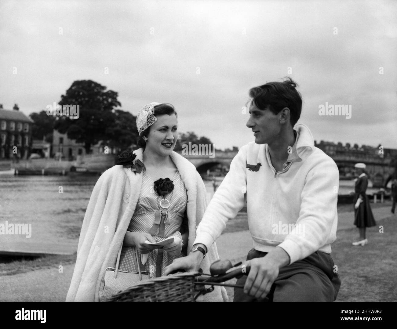 What a wonderful day for a couple in love. These two really are on top of the world today. First of all 22 year old Gill Freeman, who has just come down from Cambridge University, heard this morning that she had got her Bachelor of Arts Degree in History. Gill was down at Henley this morning to see her fianc?, 23 year old Henry Putnam, coach of the Caius College Boat Club of Cambridge University, to victory when they beat King's College, London, by two lengths. Putnam has been studying law at Cambridge, and to crown their happiness Henry this morning gave Gill an engagement ring and their enga Stock Photo