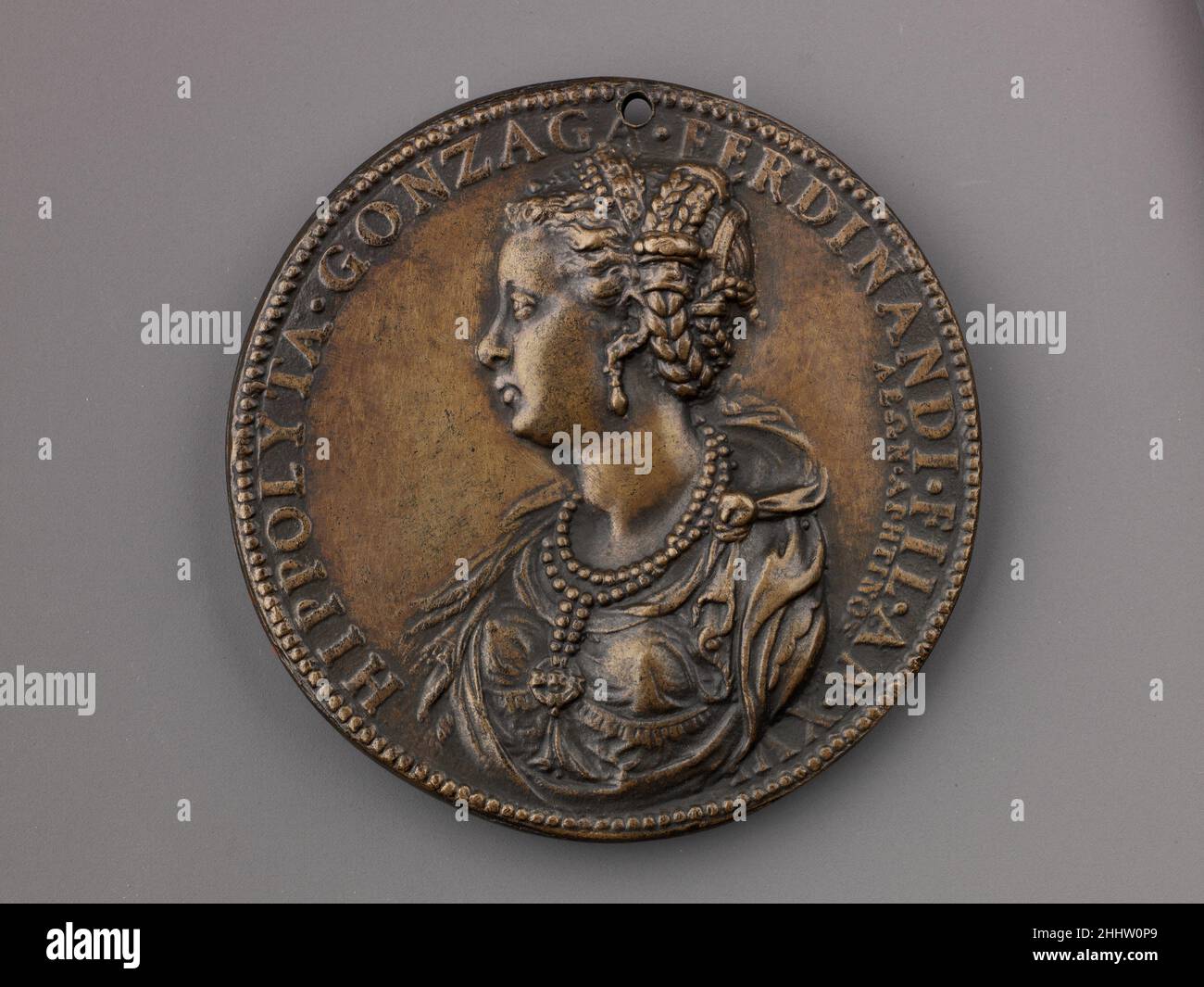 Medal: Ippolita Gonzaga model 1551 (possibly cast 19th century) Leone Leoni Italian On the obverse is a portrait of Ippolita Gonzaga of Mantua (1535 –1563), wife of Antonio Gonzaga. On the reverse isDiana, blowing a conch shell and holding a large arrow.She is accompanied by two of her dogs. Behind her isPluto, abducting Proserpina with Cerberus at his feet.This late aftercast may be from the nineteenth century.. Medal: Ippolita Gonzaga  460355 Stock Photo