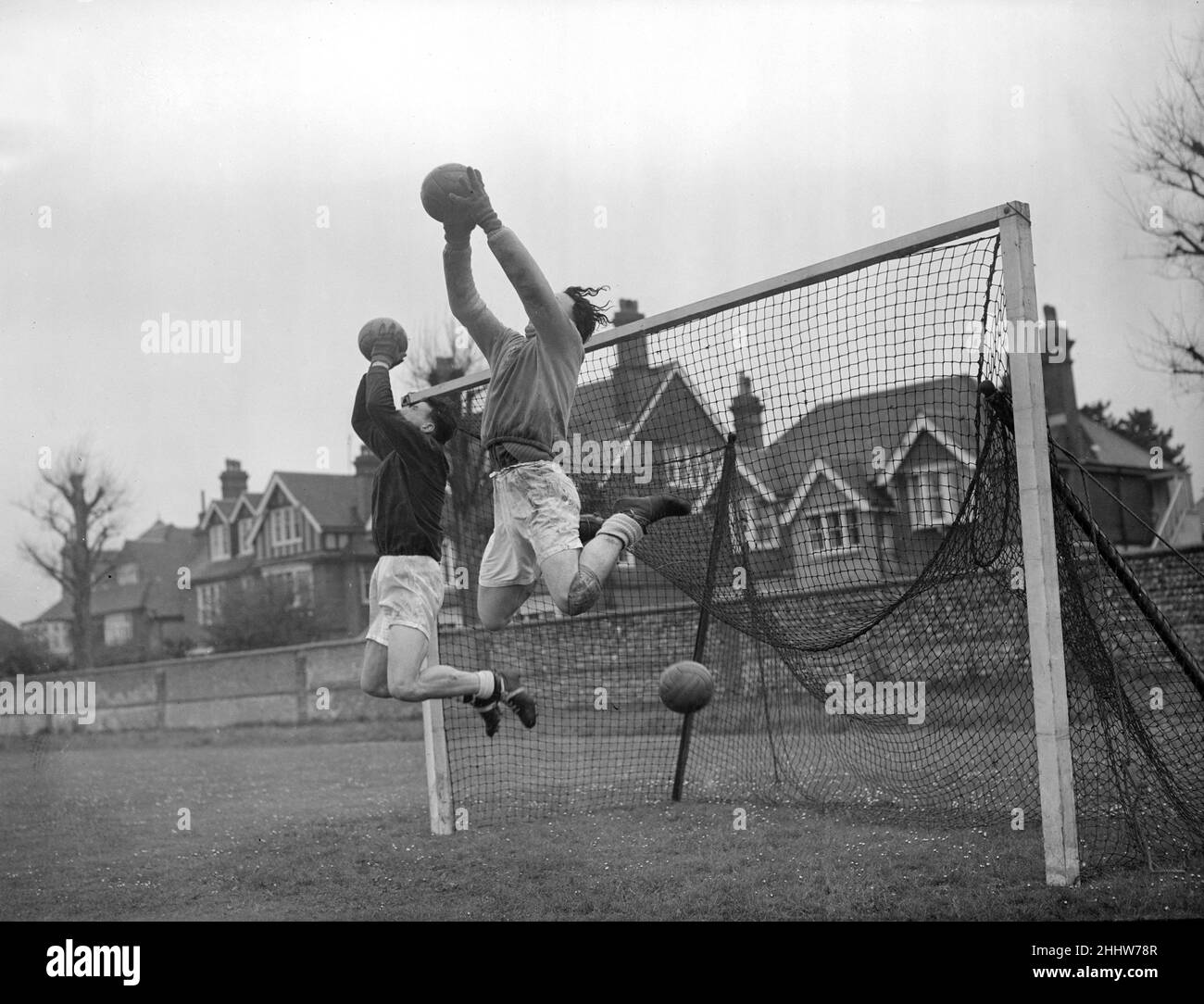 The England football team at the Saffrons, Eastbourne's Cricket and Football Ground, training for an upcoming Continental tour. King and Burgin (nearest camera) at goalkeeping practice. 4th May 1954. Stock Photo