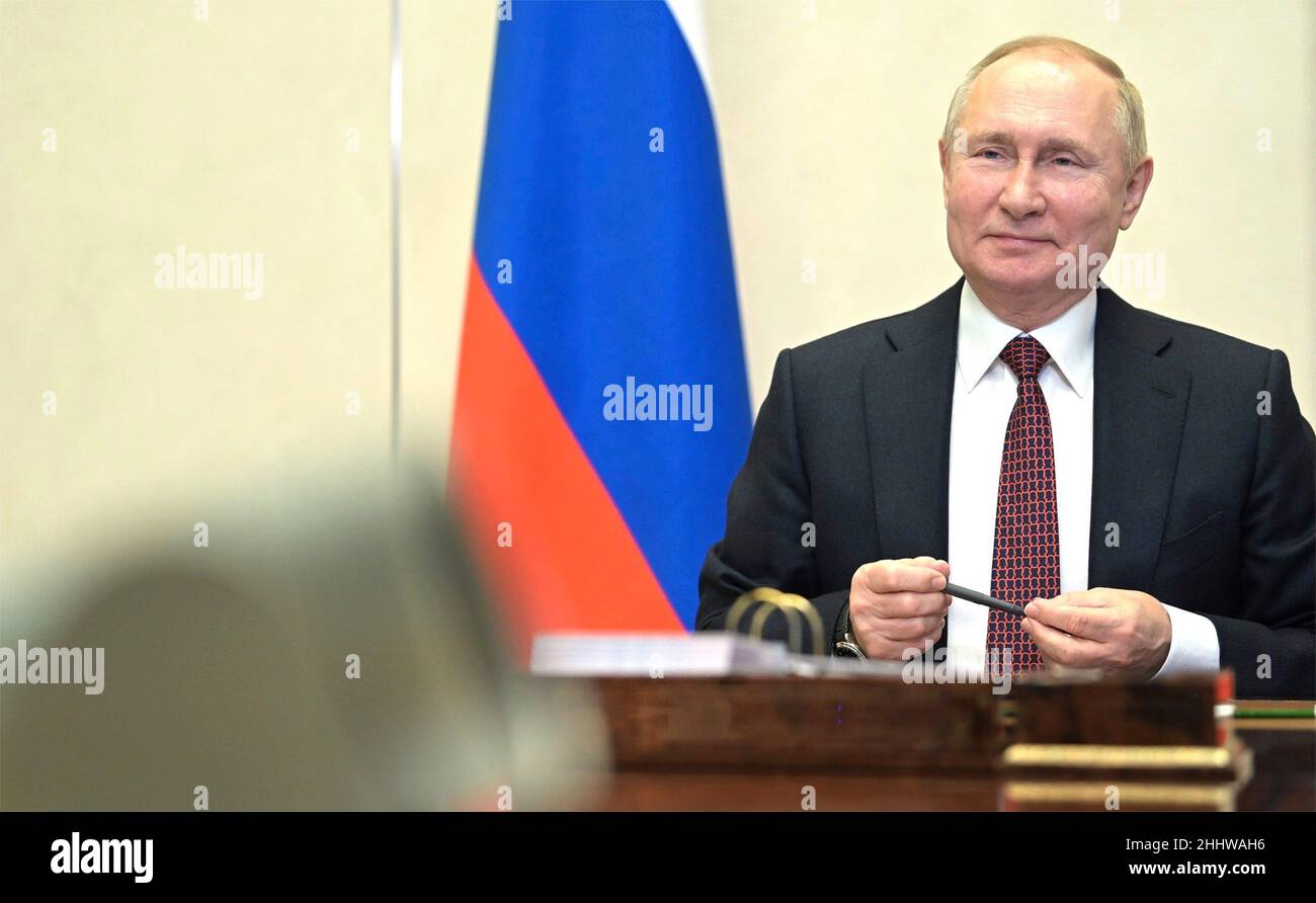 Novo-Ogaryovo, Russia. 25th Jan, 2022. Russian President Vladimir Putin holds a video conference call with members of the Russian national winter Olympics team before they depart for the Beijing 2022 Winter Olympics, from the official residence at Novo-Ogaryovo January 25, 2022 outside Moscow, Russia. Credit: Alexei Nikolsky/Kremlin Pool/Alamy Live News Stock Photo