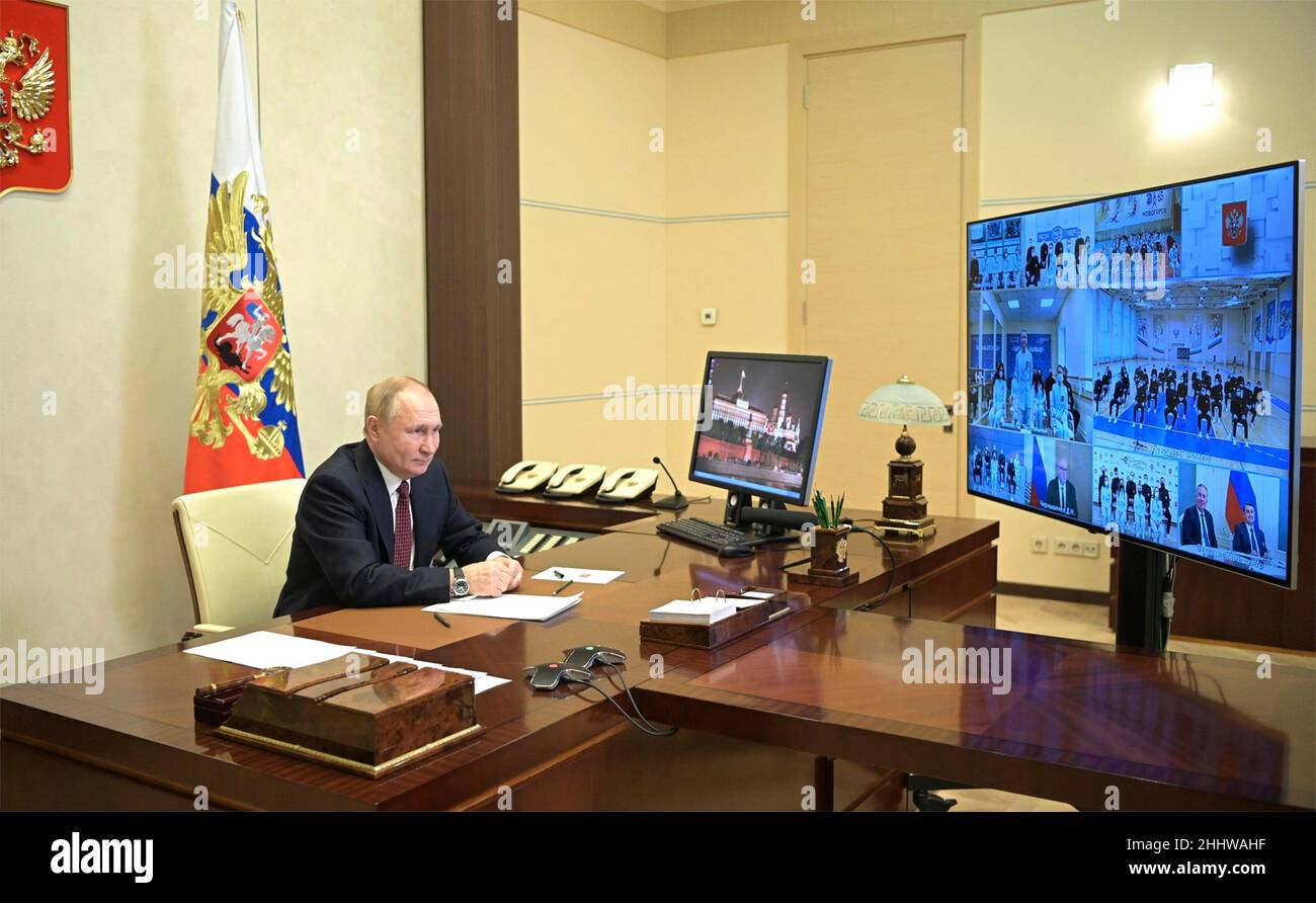 Novo-Ogaryovo, Russia. 25th Jan, 2022. Russian President Vladimir Putin holds a video conference call with members of the Russian national winter Olympics team before they depart for the Beijing 2022 Winter Olympics, from the official residence at Novo-Ogaryovo January 25, 2022 outside Moscow, Russia. Credit: Alexei Nikolsky/Kremlin Pool/Alamy Live News Stock Photo