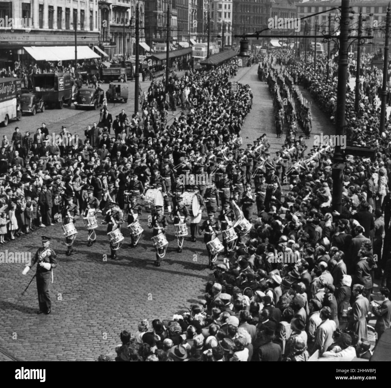 The Manchester Regiment led by the band seen here marching pass Piccadilly Gardens, Manchester. 11th May 1951 Stock Photo
