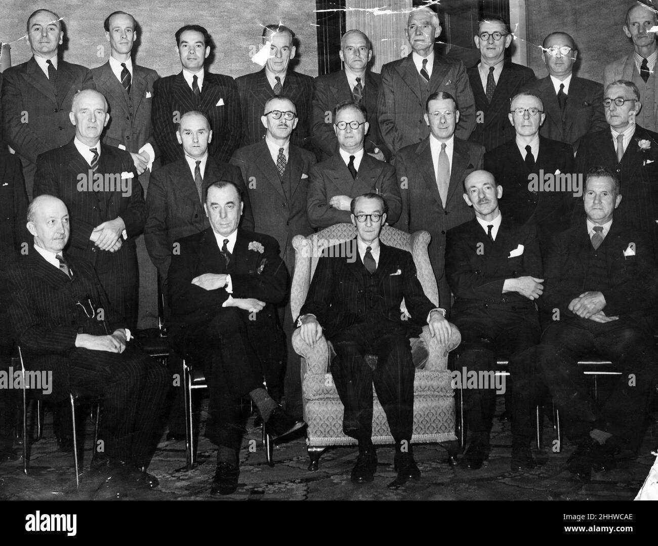 Ivor Mackenzie Thomas, who has retired from his position as manager of the Commercial Printing Department of the Western Mail and Echo Ltd, was entertained by executive officers of the company at a luncheon held at the Royal Hotel Cardiff, 24th July 1950. Our photo shows, left to right seated, Clarence Lewis, Sir Robert Webber, Ivor Mackenzie Thomas, Frank Webber, FB Lawton. Standing middle row, Edward James, David Prosser, WJ Dowling, V Perring, WO James, C Leonard, FJ Willing, DC Stephen, JH Rickard. Standing back row, H Baxendell, EO Carr, Hubert MacKenzie Thomas, R Harrison, W Hales, F Bir Stock Photo