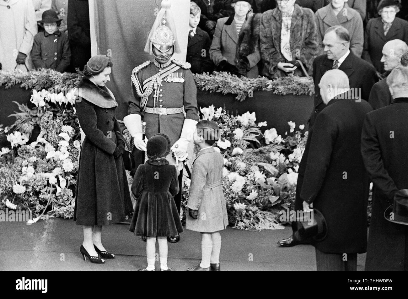 Queen Elizabeth II, with her children Prince Charles and Princess Anne, pictured  with Prime Minister Sir Winston Churchill at Waterloo Station as they await the return of the Queen Mother from her tour of the United States and Canada.24th November 1954. Stock Photo