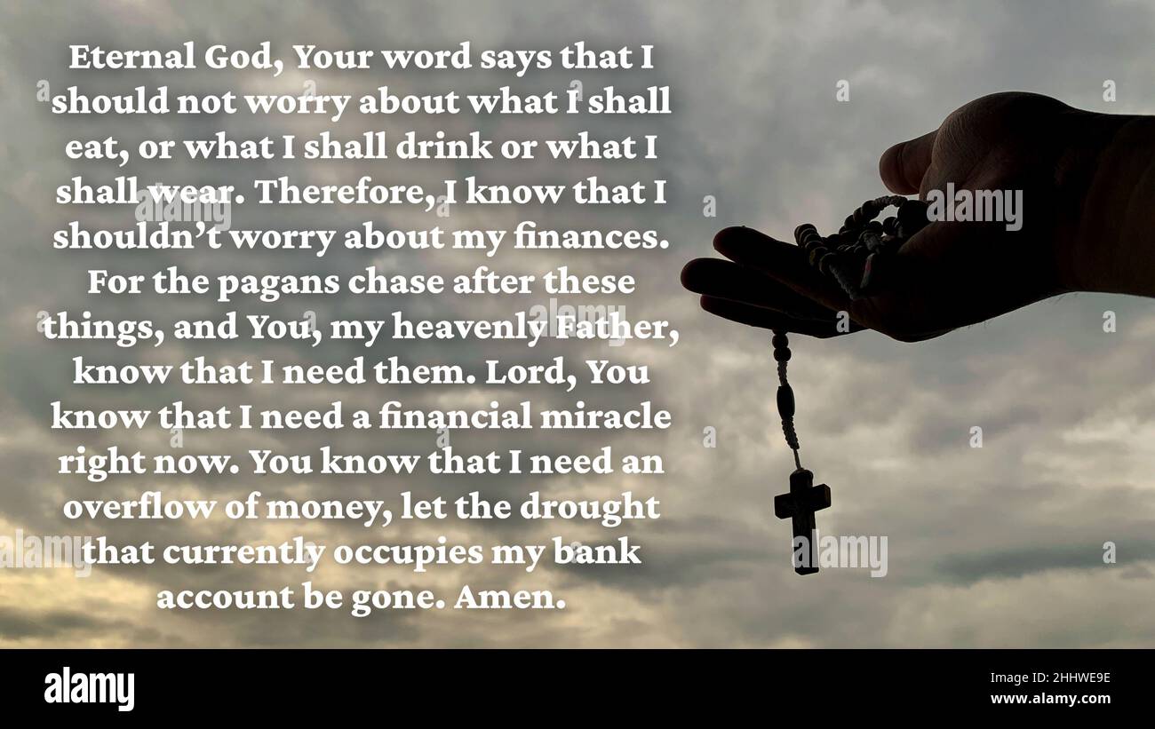 Christian prayer on financial burden with hand holding Holy Rosary